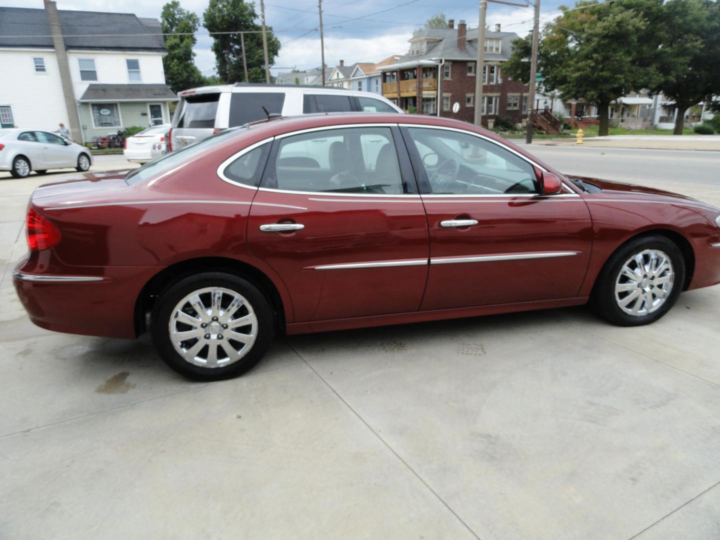 2009 Crystal Red Metallic /Greystone Buick LaCrosse CXL (2G4WD582091) with an 3.8L V6 OHV 12V engine, 4-Speed Automatic transmission, located at 827 W 26th Street, Erie, PA, 16508, (814) 455-3401, 42.105431, -80.090942 - Thanks for looking at our accident-free recent arrival. This is the CXL model with lots of options including the 3800 V6, heated leather seats, factory remote start, chrome wheels and lots more. I know this has a few miles, but it was well cared for by its previous owners as can be seen by its extra - Photo#3