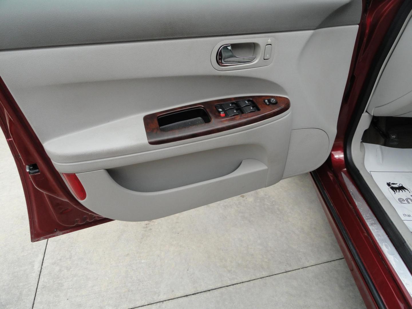 2009 Crystal Red Metallic /Greystone Buick LaCrosse CXL (2G4WD582091) with an 3.8L V6 OHV 12V engine, 4-Speed Automatic transmission, located at 827 W 26th Street, Erie, PA, 16508, (814) 455-3401, 42.105431, -80.090942 - Thanks for looking at our accident-free recent arrival. This is the CXL model with lots of options including the 3800 V6, heated leather seats, factory remote start, chrome wheels and lots more. I know this has a few miles, but it was well cared for by its previous owners as can be seen by its extra - Photo#24
