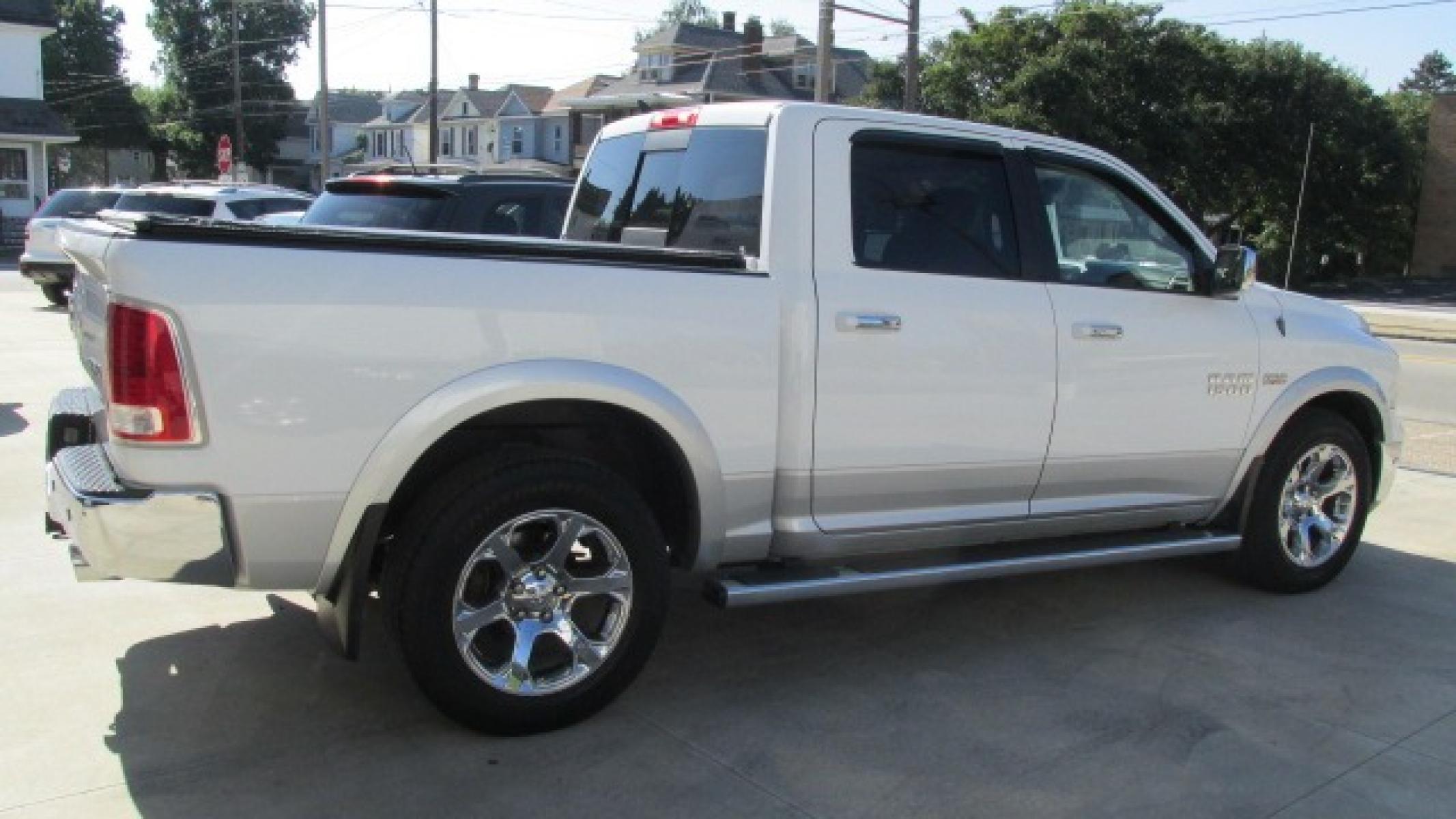 2013 Bright White Clearcoat /Tan Ram 1500 Laramie Laramie (1C6RR7NT4DS) with an 5.7L V8 OHV 16V engine, 6-Speed Automatic transmission, located at 827 W 26th Street, Erie, PA, 16508, (814) 455-3401, 42.105431, -80.090942 - Thanks for looking at our own one owner like new hard to find truck in this condition. Yes, this truck has a few miles but take a minute to read the following description. This truck was purchased by our owner back in November of 2017 from Texas where it spent its time from new. In the six years th - Photo #3