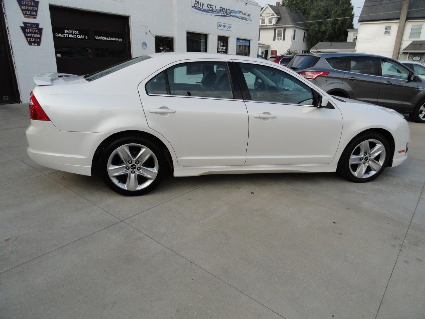2012 White Platinum Tricoat /Jet Black Ford Fusion SPORT (3FAHP0KC4CR) with an 3.5L V6 DOHC 24V engine, 4-Speed Automatic Overdrive transmission, located at 827 W 26th Street, Erie, PA, 16508, (814) 455-3401, 42.105431, -80.090942 - Thanks for looking at our super clean rust and accident-free trade in. We sold this vehicle a few years ago and just took it back in on trade, and it's in the best condition I've seen in years with a rust-free exterior as well as a like new interior. This is the Sport model with the V-6 motor, dual- Photo#3