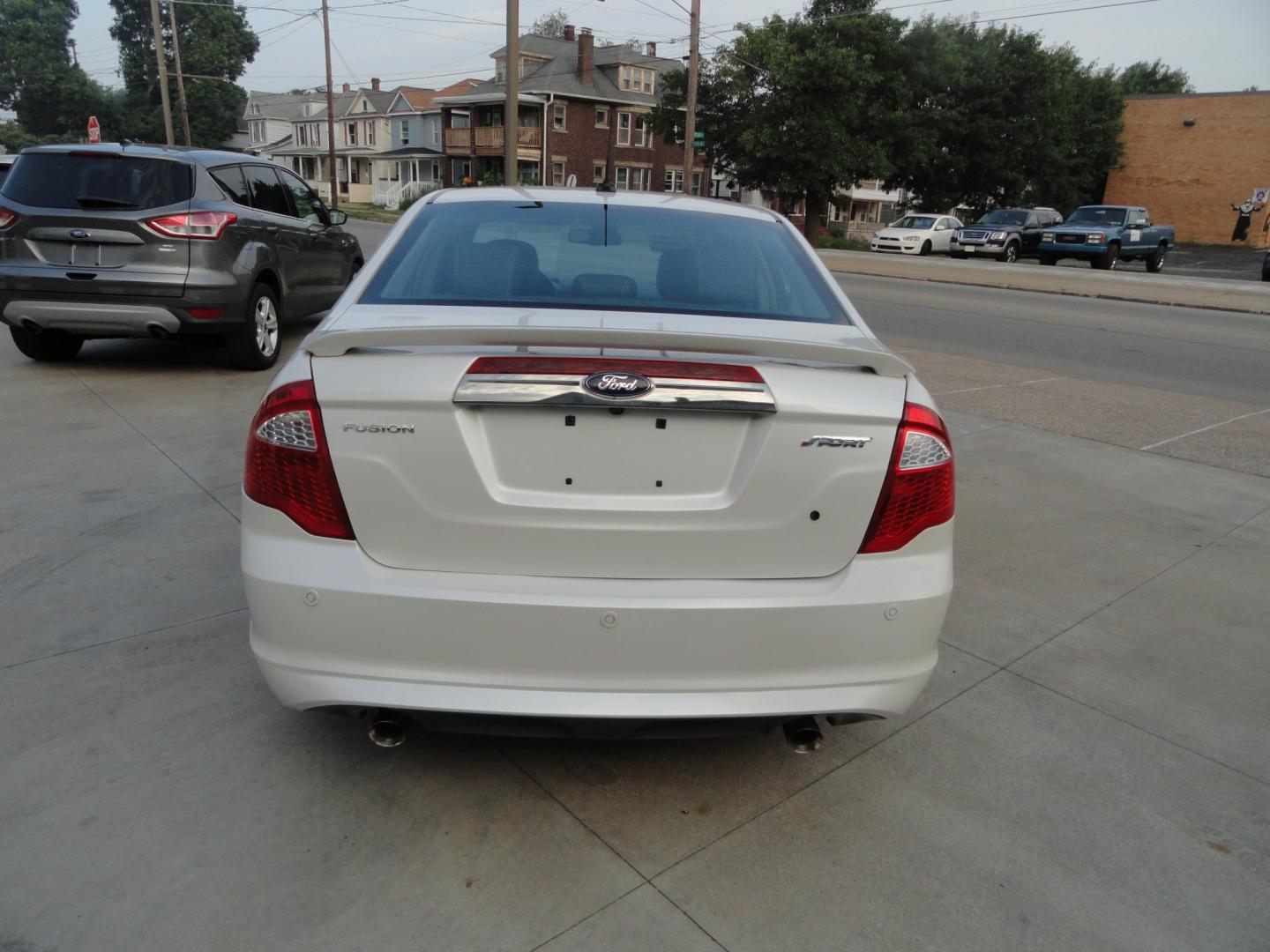 2012 White Platinum Tricoat /Jet Black Ford Fusion SPORT (3FAHP0KC4CR) with an 3.5L V6 DOHC 24V engine, 4-Speed Automatic Overdrive transmission, located at 827 W 26th Street, Erie, PA, 16508, (814) 455-3401, 42.105431, -80.090942 - Thanks for looking at our super clean rust and accident-free trade in. We sold this vehicle a few years ago and just took it back in on trade, and it's in the best condition I've seen in years with a rust-free exterior as well as a like new interior. This is the Sport model with the V-6 motor, dual- Photo#4