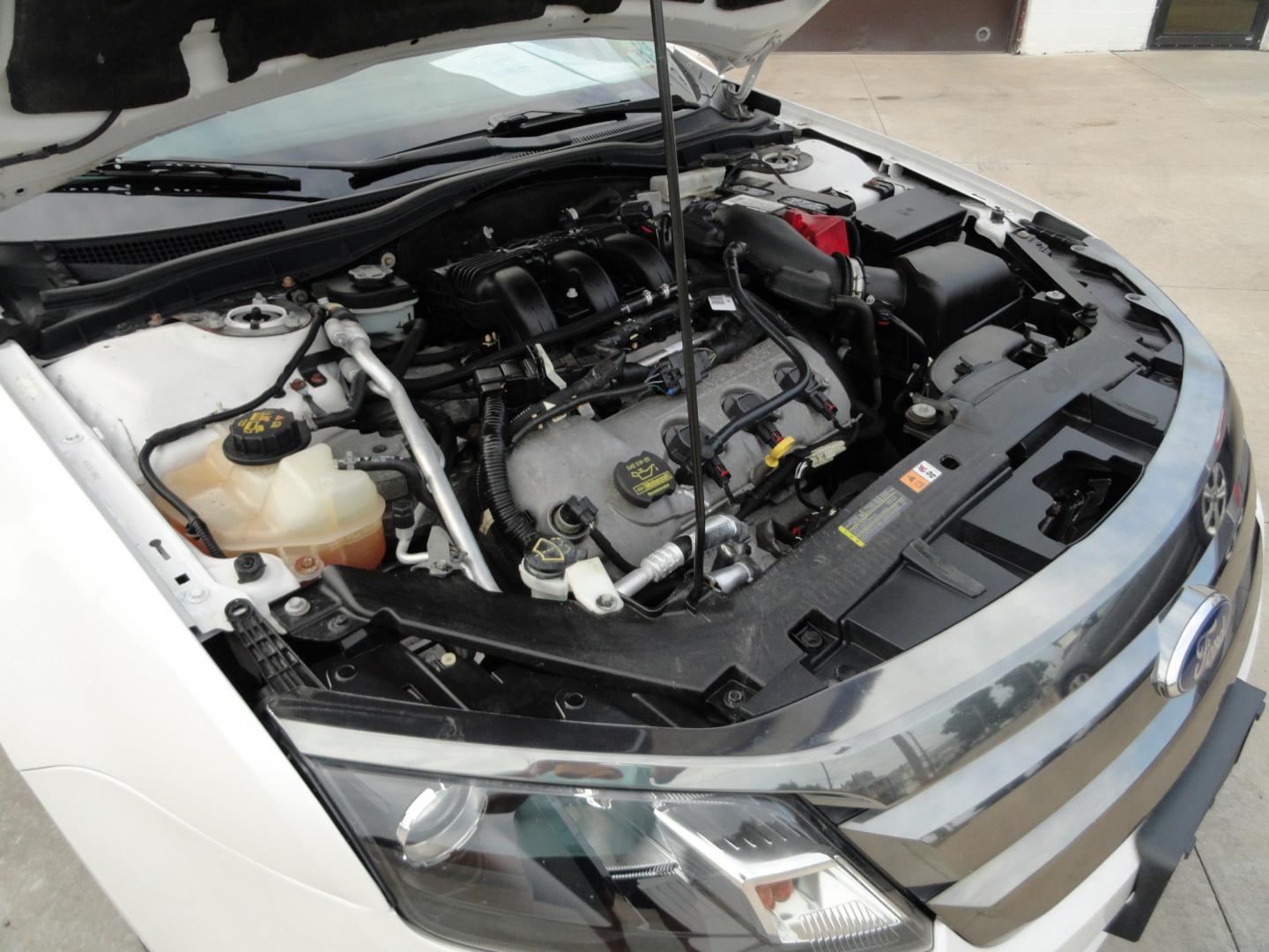 2012 White Platinum Tricoat /Jet Black Ford Fusion SPORT (3FAHP0KC4CR) with an 3.5L V6 DOHC 24V engine, 4-Speed Automatic Overdrive transmission, located at 827 W 26th Street, Erie, PA, 16508, (814) 455-3401, 42.105431, -80.090942 - Thanks for looking at our super clean rust and accident-free trade in. We sold this vehicle a few years ago and just took it back in on trade, and it's in the best condition I've seen in years with a rust-free exterior as well as a like new interior. This is the Sport model with the V-6 motor, dual- Photo#35