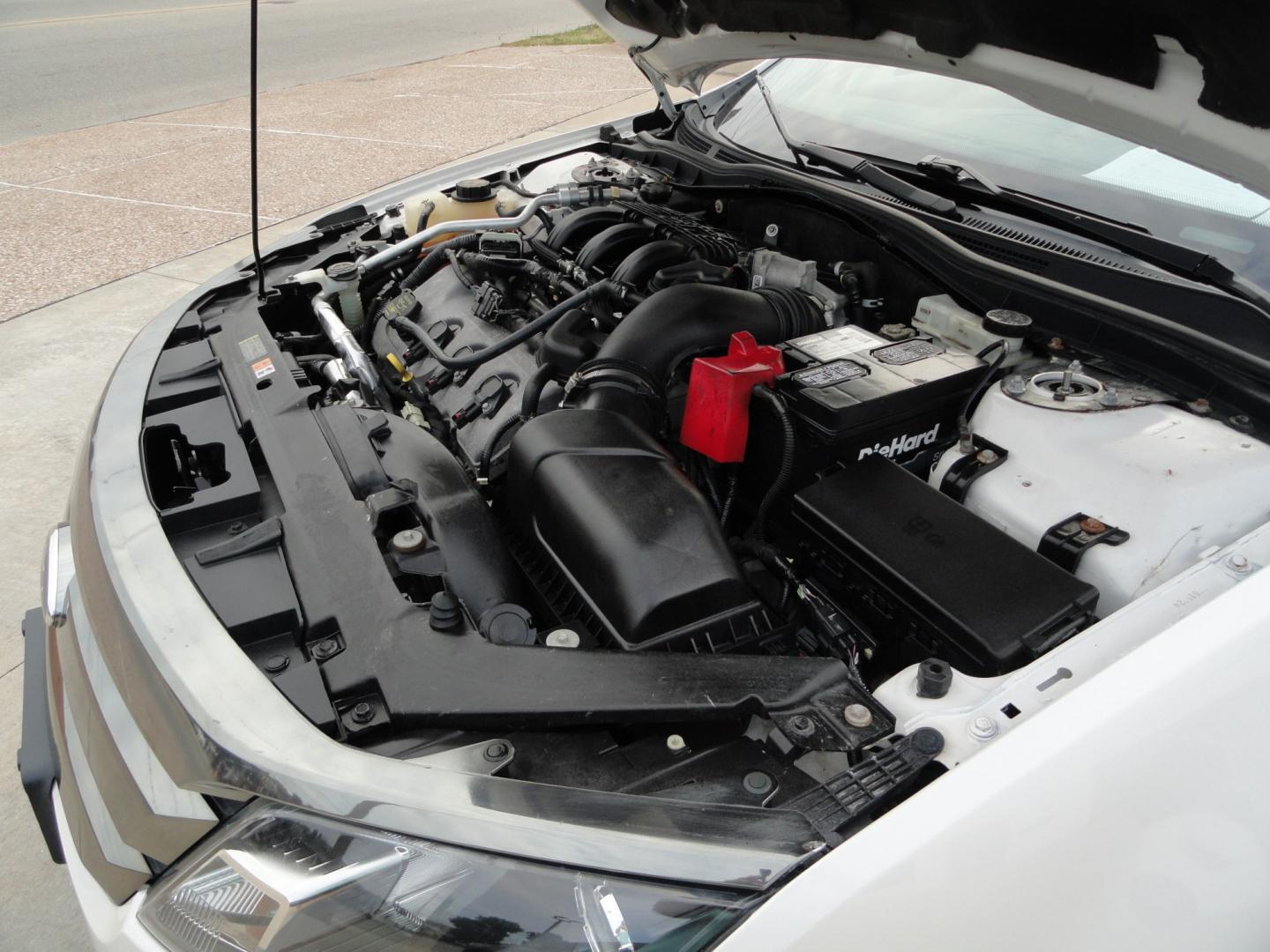 2012 White Platinum Tricoat /Jet Black Ford Fusion SPORT (3FAHP0KC4CR) with an 3.5L V6 DOHC 24V engine, 4-Speed Automatic Overdrive transmission, located at 827 W 26th Street, Erie, PA, 16508, (814) 455-3401, 42.105431, -80.090942 - Thanks for looking at our super clean rust and accident-free trade in. We sold this vehicle a few years ago and just took it back in on trade, and it's in the best condition I've seen in years with a rust-free exterior as well as a like new interior. This is the Sport model with the V-6 motor, dual- Photo#37