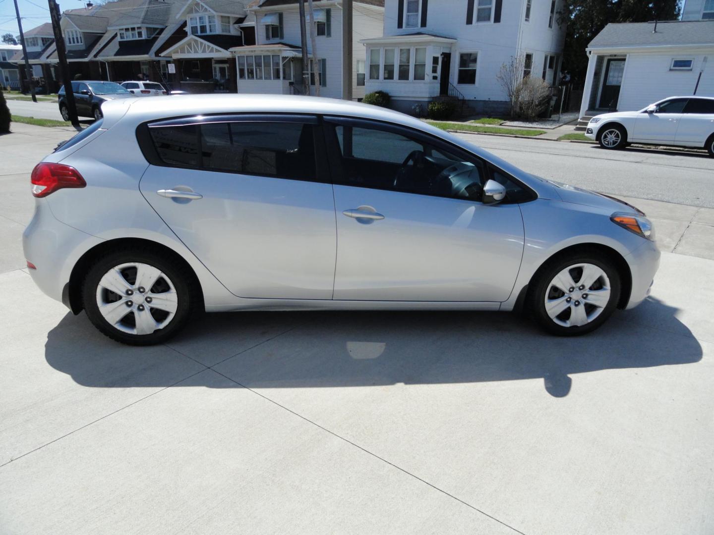 2016 Silky Silver Metallic /Greystone Kia Forte 5-Door LX (KNAFK5A81G5) with an 2.0L L4 DOHC 16V engine, 6-Speed Automatic transmission, located at 827 W 26th Street, Erie, PA, 16508, (814) 455-3401, 42.105431, -80.090942 - Thanks for looking at our one owner accident and rust-free new Ford trade. This is the LX model with lots of options and it comes with like new exterior plus a nonsmoker interior. A recent Pa state and emissions inspection, lube oil and filter change were just completed in our service department. Hu - Photo#3
