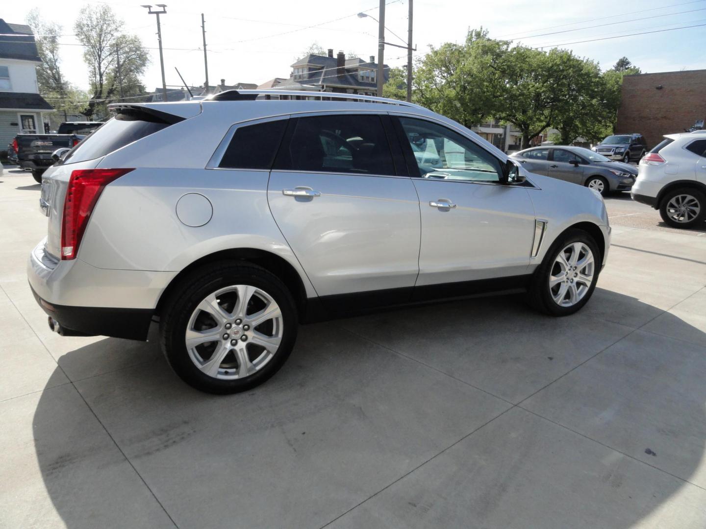 2015 Switchblade Silver Metallic /Jet Black Cadillac SRX-4 Performance Collection AWD (3GYFNFE34FS) with an 3.6L V6 DOHC 24V FFV engine, 6-Speed Automatic transmission, located at 827 W 26th Street, Erie, PA, 16508, (814) 455-3401, 42.105431, -80.090942 - Thanks for looking at our two-owner rust free like new trade in. This SUV just came back in on trade from a previous owner who trade it back in to us on a Cadillac XT5. This is the Performance model with all the options including all wheel drive, dual power heated front seats, remote start, a panora - Photo#3