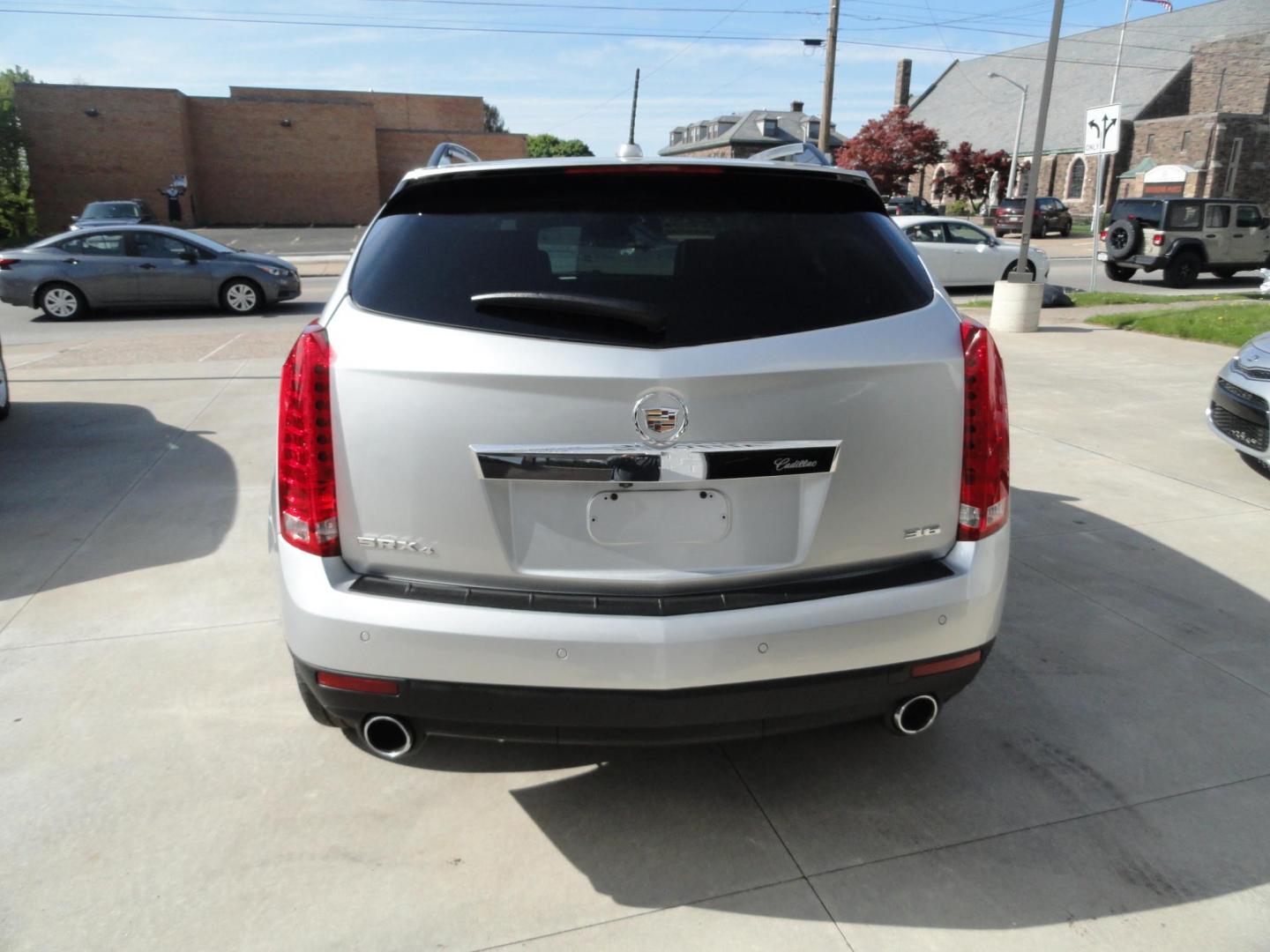 2015 Switchblade Silver Metallic /Jet Black Cadillac SRX-4 Performance Collection AWD (3GYFNFE34FS) with an 3.6L V6 DOHC 24V FFV engine, 6-Speed Automatic transmission, located at 827 W 26th Street, Erie, PA, 16508, (814) 455-3401, 42.105431, -80.090942 - Thanks for looking at our two-owner rust free like new trade in. This SUV just came back in on trade from a previous owner who trade it back in to us on a Cadillac XT5. This is the Performance model with all the options including all wheel drive, dual power heated front seats, remote start, a panora - Photo#4