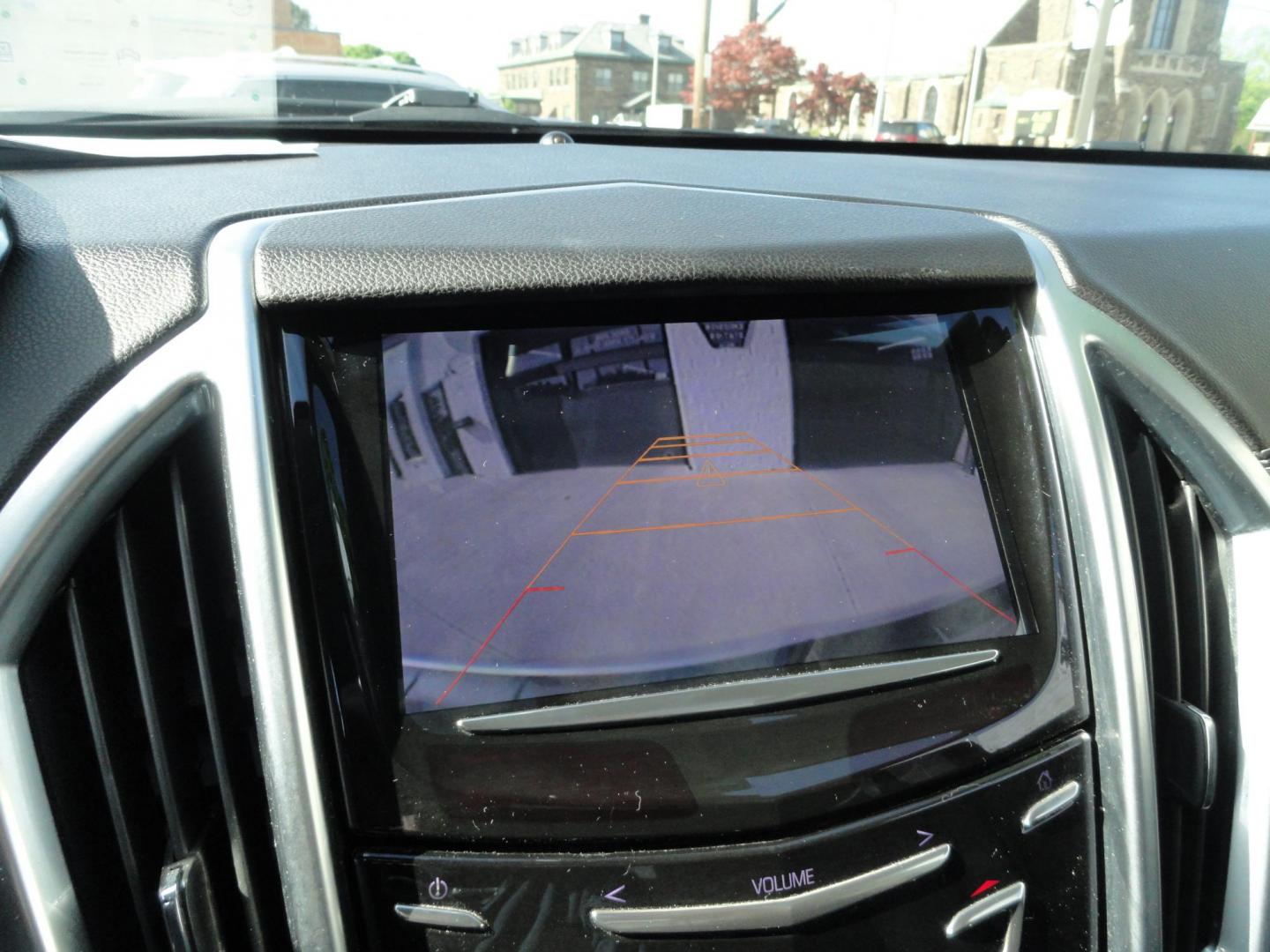 2015 Switchblade Silver Metallic /Jet Black Cadillac SRX-4 Performance Collection AWD (3GYFNFE34FS) with an 3.6L V6 DOHC 24V FFV engine, 6-Speed Automatic transmission, located at 827 W 26th Street, Erie, PA, 16508, (814) 455-3401, 42.105431, -80.090942 - Thanks for looking at our two-owner rust free like new trade in. This SUV just came back in on trade from a previous owner who trade it back in to us on a Cadillac XT5. This is the Performance model with all the options including all wheel drive, dual power heated front seats, remote start, a panora - Photo#11