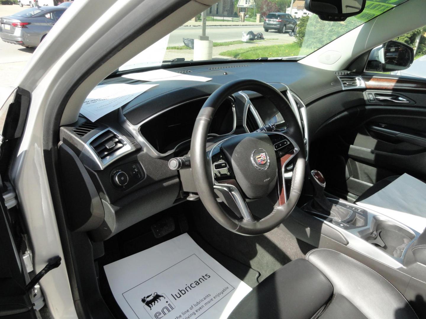 2015 Switchblade Silver Metallic /Jet Black Cadillac SRX-4 Performance Collection AWD (3GYFNFE34FS) with an 3.6L V6 DOHC 24V FFV engine, 6-Speed Automatic transmission, located at 827 W 26th Street, Erie, PA, 16508, (814) 455-3401, 42.105431, -80.090942 - Thanks for looking at our two-owner rust free like new trade in. This SUV just came back in on trade from a previous owner who trade it back in to us on a Cadillac XT5. This is the Performance model with all the options including all wheel drive, dual power heated front seats, remote start, a panora - Photo#22