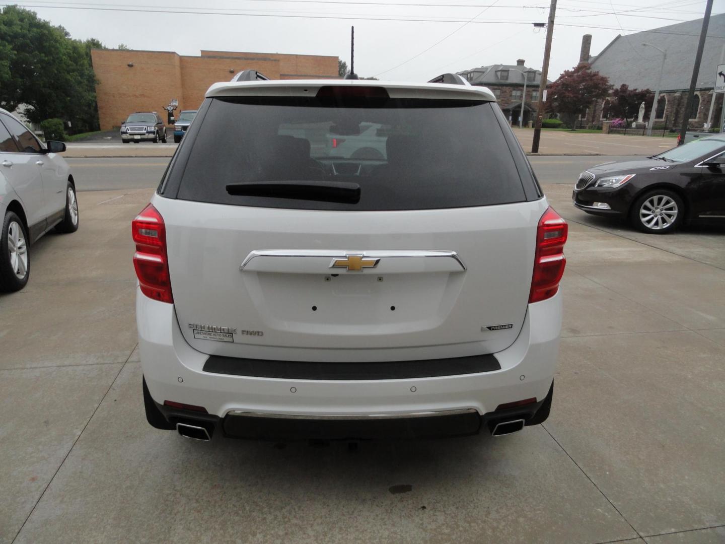 2017 Frost White Tricoat /Graphite Chevrolet Equinox Premier AWD (2GNFLGE34H6) with an 3.6L V6 DOHC 24V engine, 6 Automatic transmission, located at 827 W 26th Street, Erie, PA, 16508, (814) 455-3401, 42.105431, -80.090942 - Thanks for looking at our two-owner accident and rust-free new arrival. This SUV belongs to one of our owners and was his wife's driver for the last five years which explains the like new condition of the nonsmoker like new interior as well as the damage free exterior. This is the Premier model with - Photo#4