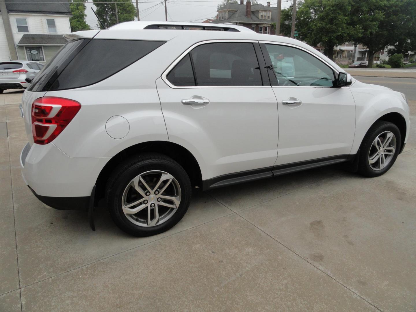 2017 Frost White Tricoat /Graphite Chevrolet Equinox Premier AWD (2GNFLGE34H6) with an 3.6L V6 DOHC 24V engine, 6 Automatic transmission, located at 827 W 26th Street, Erie, PA, 16508, (814) 455-3401, 42.105431, -80.090942 - Thanks for looking at our two-owner accident and rust-free new arrival. This SUV belongs to one of our owners and was his wife's driver for the last five years which explains the like new condition of the nonsmoker like new interior as well as the damage free exterior. This is the Premier model with - Photo#3