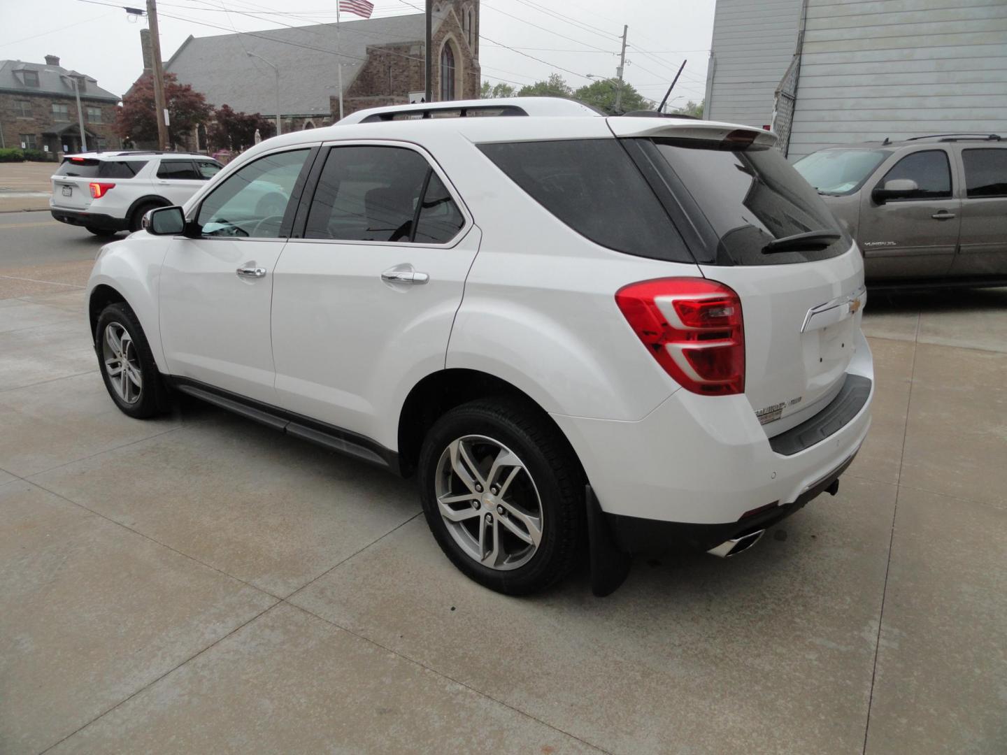 2017 Frost White Tricoat /Graphite Chevrolet Equinox Premier AWD (2GNFLGE34H6) with an 3.6L V6 DOHC 24V engine, 6 Automatic transmission, located at 827 W 26th Street, Erie, PA, 16508, (814) 455-3401, 42.105431, -80.090942 - Thanks for looking at our two-owner accident and rust-free new arrival. This SUV belongs to one of our owners and was his wife's driver for the last five years which explains the like new condition of the nonsmoker like new interior as well as the damage free exterior. This is the Premier model with - Photo#5