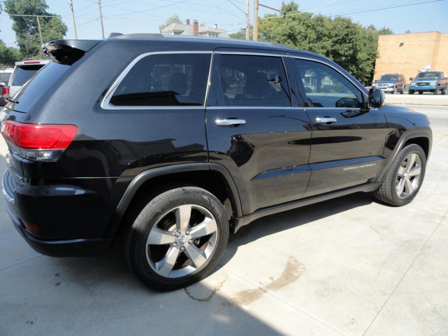 2014 Brillant Black Crystal /Jet Black Jeep Grand Cherokee Limited 4WD (1C4RJFBG7EC) with an 3.6L V6 DOHC 24V engine, 5-Speed Automatic transmission, located at 827 W 26th Street, Erie, PA, 16508, (814) 455-3401, 42.105431, -80.090942 - Thanks for looking at our low mileage rust free new Jeep trade. This is the Limited model with all wheel drive, power sunroof, power lift gate, power drivers seat, remote start, heated front and second row seats, navigation, blind spot monitor, upgrade wheels and lots more. A full service was just c - Photo#3