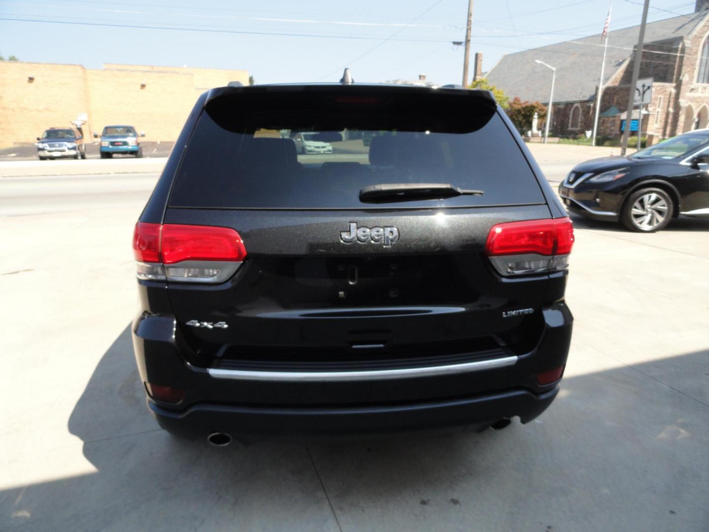 2014 Brillant Black Crystal /Jet Black Jeep Grand Cherokee Limited 4WD (1C4RJFBG7EC) with an 3.6L V6 DOHC 24V engine, 5-Speed Automatic transmission, located at 827 W 26th Street, Erie, PA, 16508, (814) 455-3401, 42.105431, -80.090942 - Thanks for looking at our low mileage rust free new Jeep trade. This is the Limited model with all wheel drive, power sunroof, power lift gate, power drivers seat, remote start, heated front and second row seats, navigation, blind spot monitor, upgrade wheels and lots more. A full service was just c - Photo#4