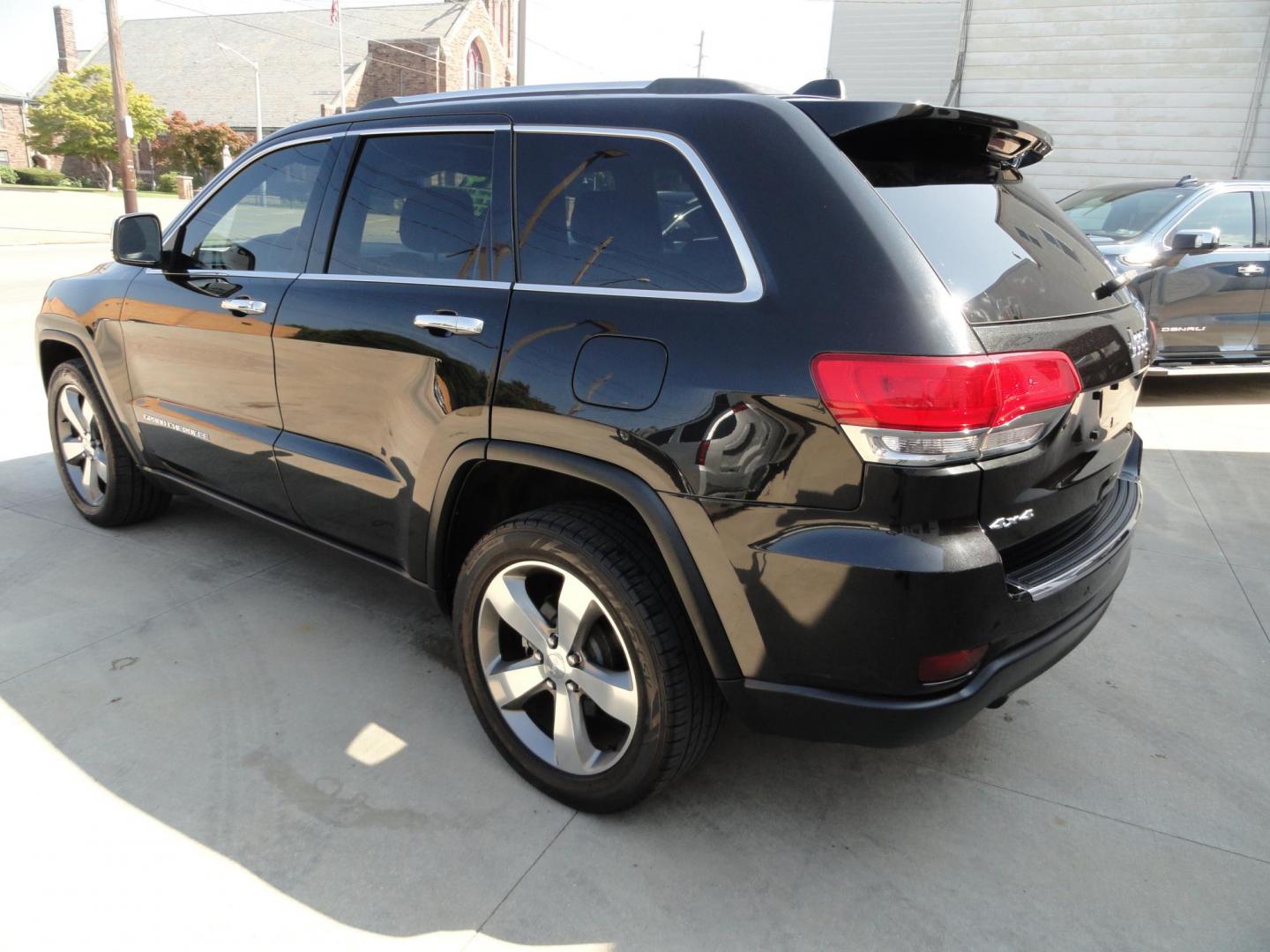 2014 Brillant Black Crystal /Jet Black Jeep Grand Cherokee Limited 4WD (1C4RJFBG7EC) with an 3.6L V6 DOHC 24V engine, 5-Speed Automatic transmission, located at 827 W 26th Street, Erie, PA, 16508, (814) 455-3401, 42.105431, -80.090942 - Thanks for looking at our low mileage rust free new Jeep trade. This is the Limited model with all wheel drive, power sunroof, power lift gate, power drivers seat, remote start, heated front and second row seats, navigation, blind spot monitor, upgrade wheels and lots more. A full service was just c - Photo#5