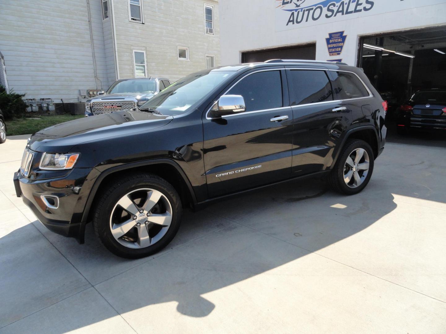 2014 Brillant Black Crystal /Jet Black Jeep Grand Cherokee Limited 4WD (1C4RJFBG7EC) with an 3.6L V6 DOHC 24V engine, 5-Speed Automatic transmission, located at 827 W 26th Street, Erie, PA, 16508, (814) 455-3401, 42.105431, -80.090942 - Thanks for looking at our low mileage rust free new Jeep trade. This is the Limited model with all wheel drive, power sunroof, power lift gate, power drivers seat, remote start, heated front and second row seats, navigation, blind spot monitor, upgrade wheels and lots more. A full service was just c - Photo#6