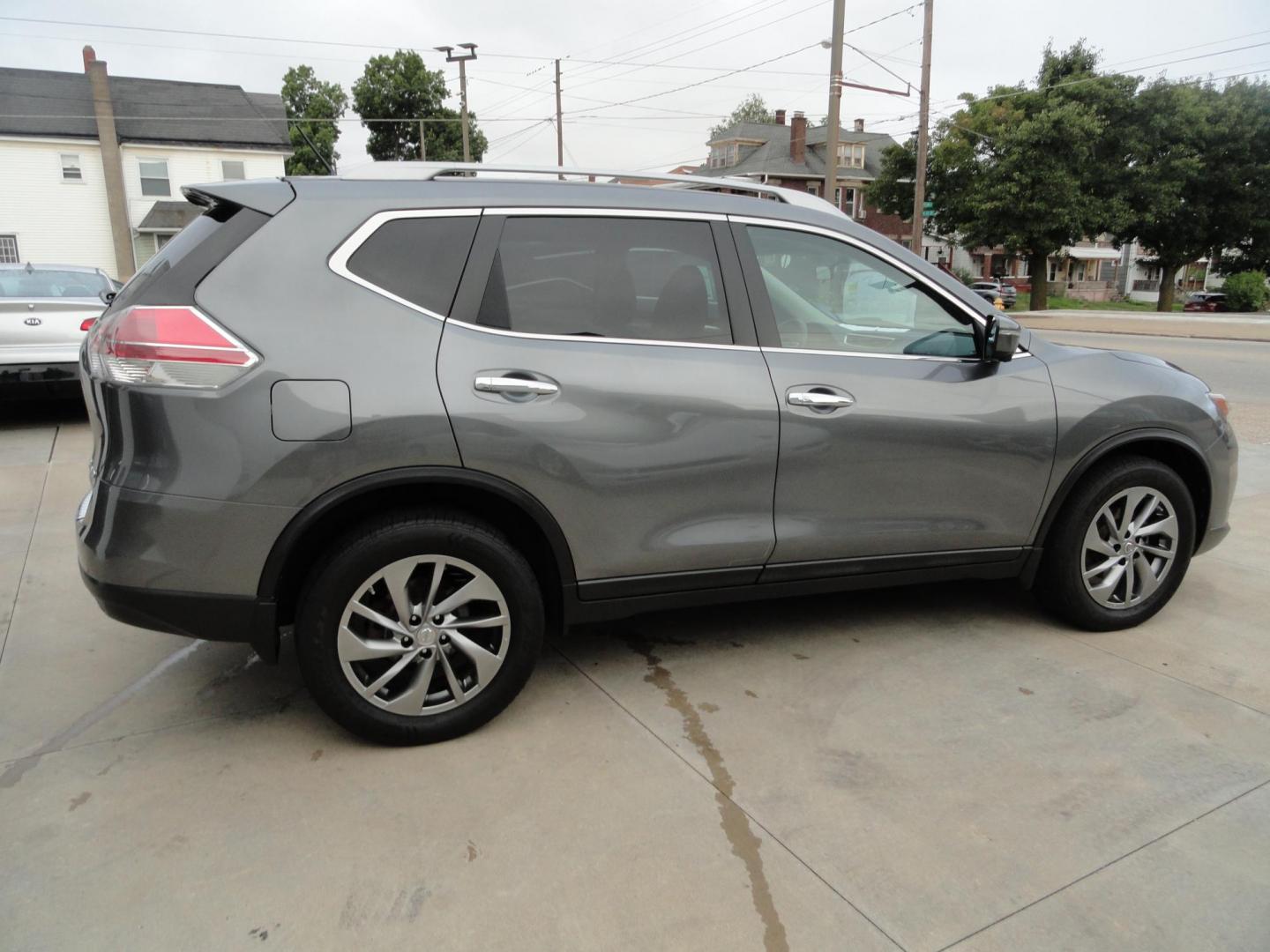 2015 Gun Metallic /Jet Black Nissan Rogue SL (5N1AT2MV1FC) with an 2.5L L4 DOHC 16V engine, Continuously Variable Transmission transmission, located at 827 W 26th Street, Erie, PA, 16508, (814) 455-3401, 42.105431, -80.090942 - Thanks for looking at our own owner, nonsmoker, accident and rust-free new Nissan trade. This is the SL model with all wheel drive, panoramic sunroof, power drivers seat, power lift gate, passive entry, heated front seats, push button start, back up camera with surround cameras, navigation, blind sp - Photo#3