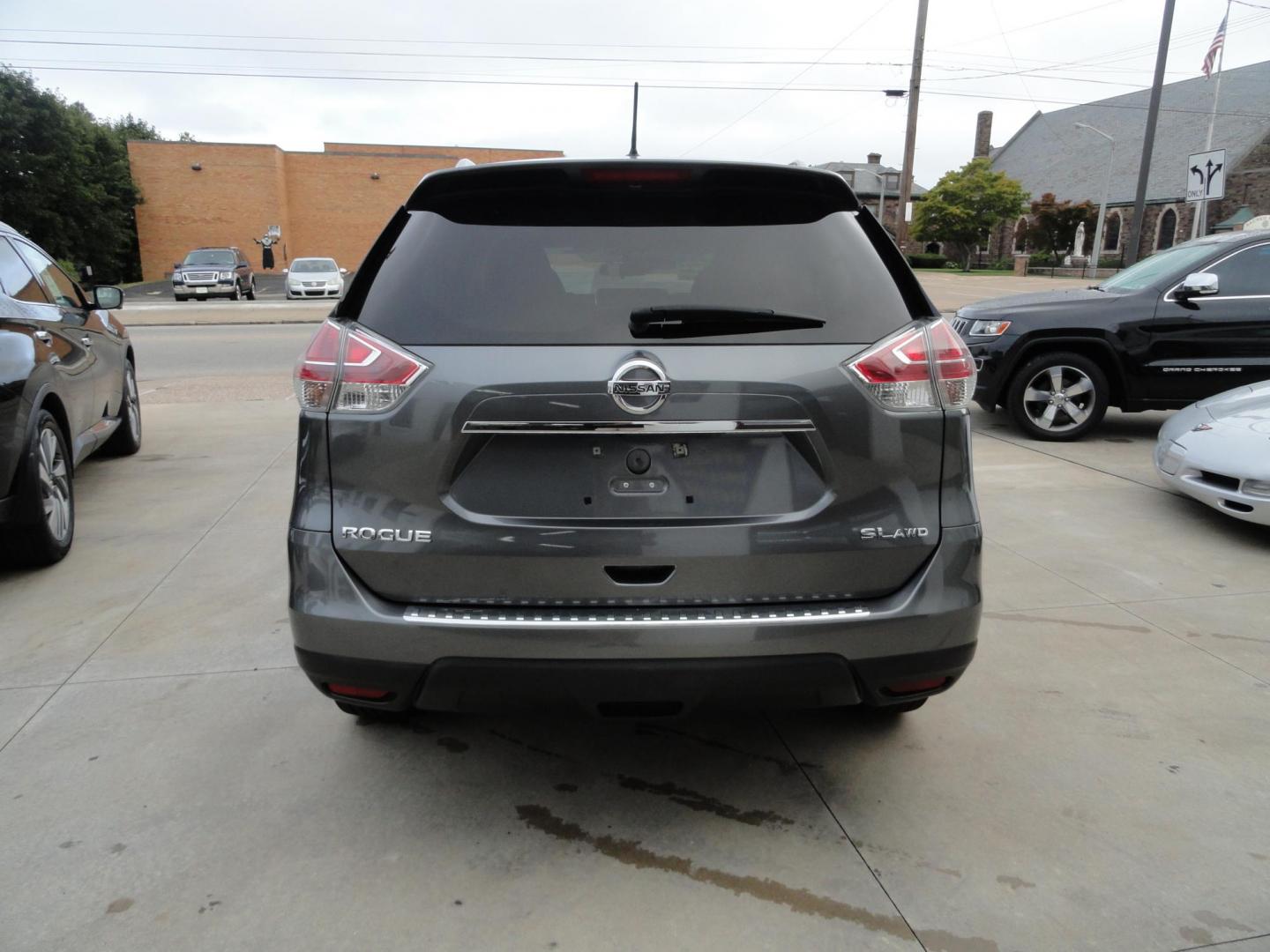 2015 Gun Metallic /Jet Black Nissan Rogue SL (5N1AT2MV1FC) with an 2.5L L4 DOHC 16V engine, Continuously Variable Transmission transmission, located at 827 W 26th Street, Erie, PA, 16508, (814) 455-3401, 42.105431, -80.090942 - Thanks for looking at our own owner, nonsmoker, accident and rust-free new Nissan trade. This is the SL model with all wheel drive, panoramic sunroof, power drivers seat, power lift gate, passive entry, heated front seats, push button start, back up camera with surround cameras, navigation, blind sp - Photo#4