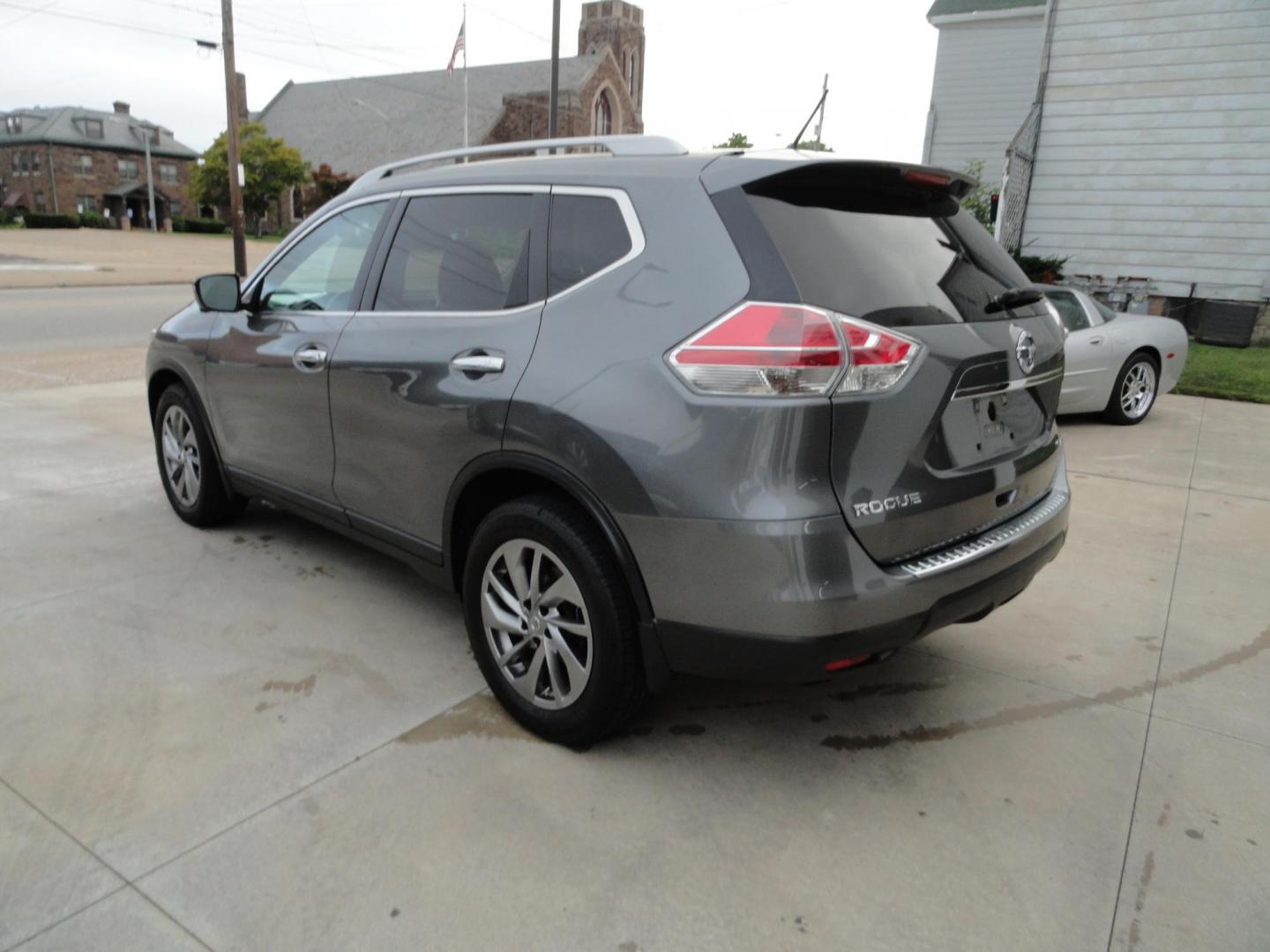 2015 Gun Metallic /Jet Black Nissan Rogue SL (5N1AT2MV1FC) with an 2.5L L4 DOHC 16V engine, Continuously Variable Transmission transmission, located at 827 W 26th Street, Erie, PA, 16508, (814) 455-3401, 42.105431, -80.090942 - Thanks for looking at our own owner, nonsmoker, accident and rust-free new Nissan trade. This is the SL model with all wheel drive, panoramic sunroof, power drivers seat, power lift gate, passive entry, heated front seats, push button start, back up camera with surround cameras, navigation, blind sp - Photo#5
