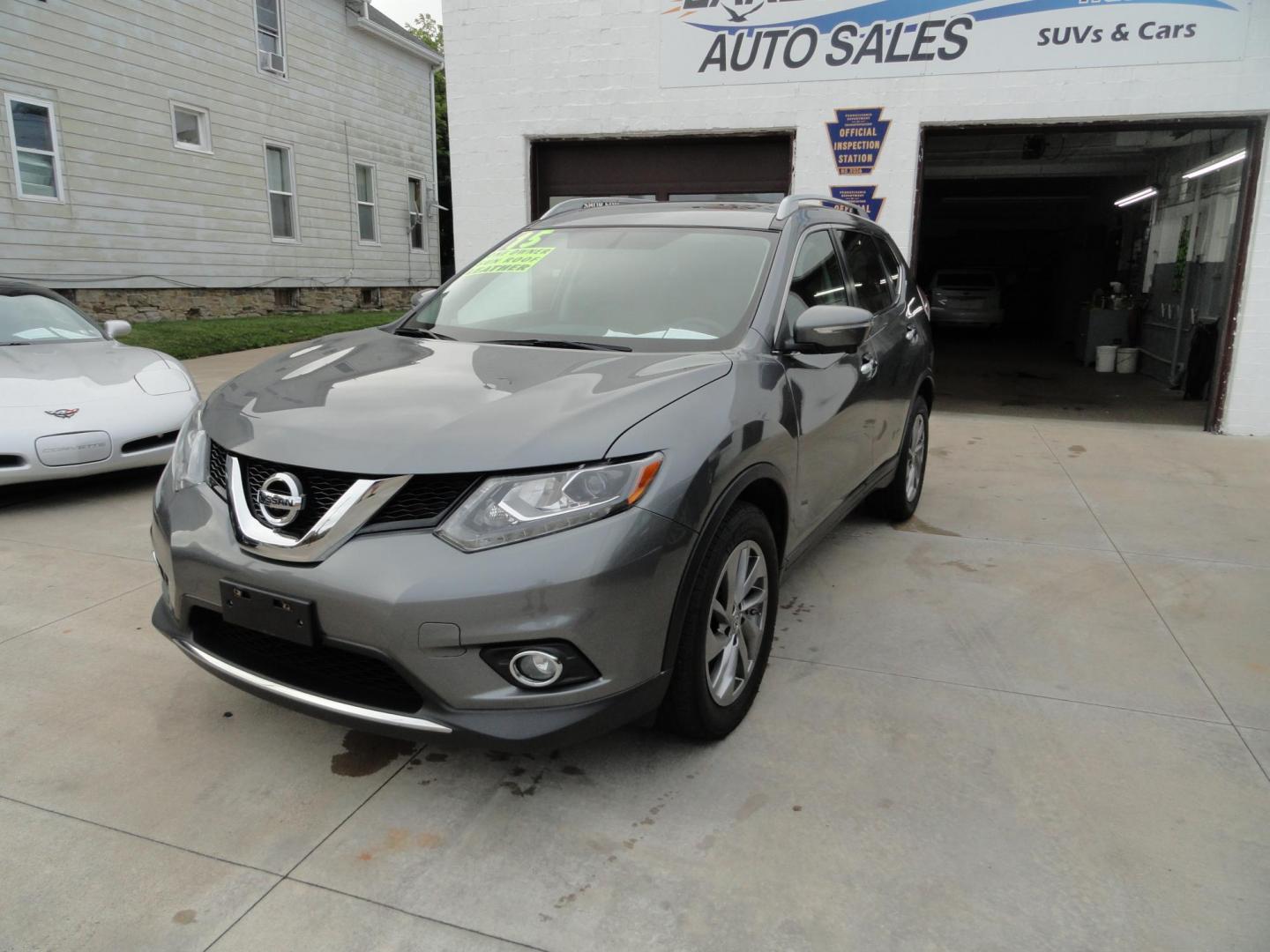 2015 Gun Metallic /Jet Black Nissan Rogue SL (5N1AT2MV1FC) with an 2.5L L4 DOHC 16V engine, Continuously Variable Transmission transmission, located at 827 W 26th Street, Erie, PA, 16508, (814) 455-3401, 42.105431, -80.090942 - Thanks for looking at our own owner, nonsmoker, accident and rust-free new Nissan trade. This is the SL model with all wheel drive, panoramic sunroof, power drivers seat, power lift gate, passive entry, heated front seats, push button start, back up camera with surround cameras, navigation, blind sp - Photo#7
