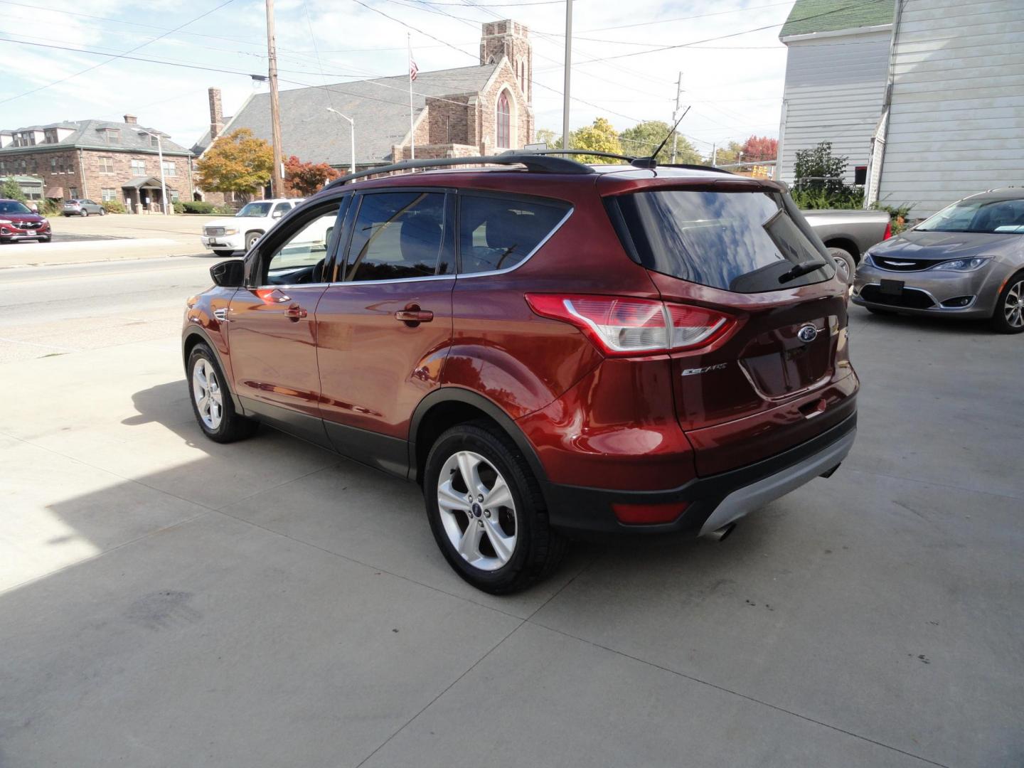 2014 Sunset Metallic /Greystone Ford Escape SE 4WD (1FMCU9GX3EU) with an 1.6L L4 DOHC 16V engine, 6-Speed Automatic transmission, located at 827 W 26th Street, Erie, PA, 16508, (814) 455-3401, 42.105431, -80.090942 - Thanks for looking at out two owner accident and rust-free new arrival. This is the SE model with all wheel drive, power drivers sear, panoramic sunroof, rear parking aids, back up camera, large touch screen and lots more. A full service was just completed in our service department with new Pa state - Photo#5