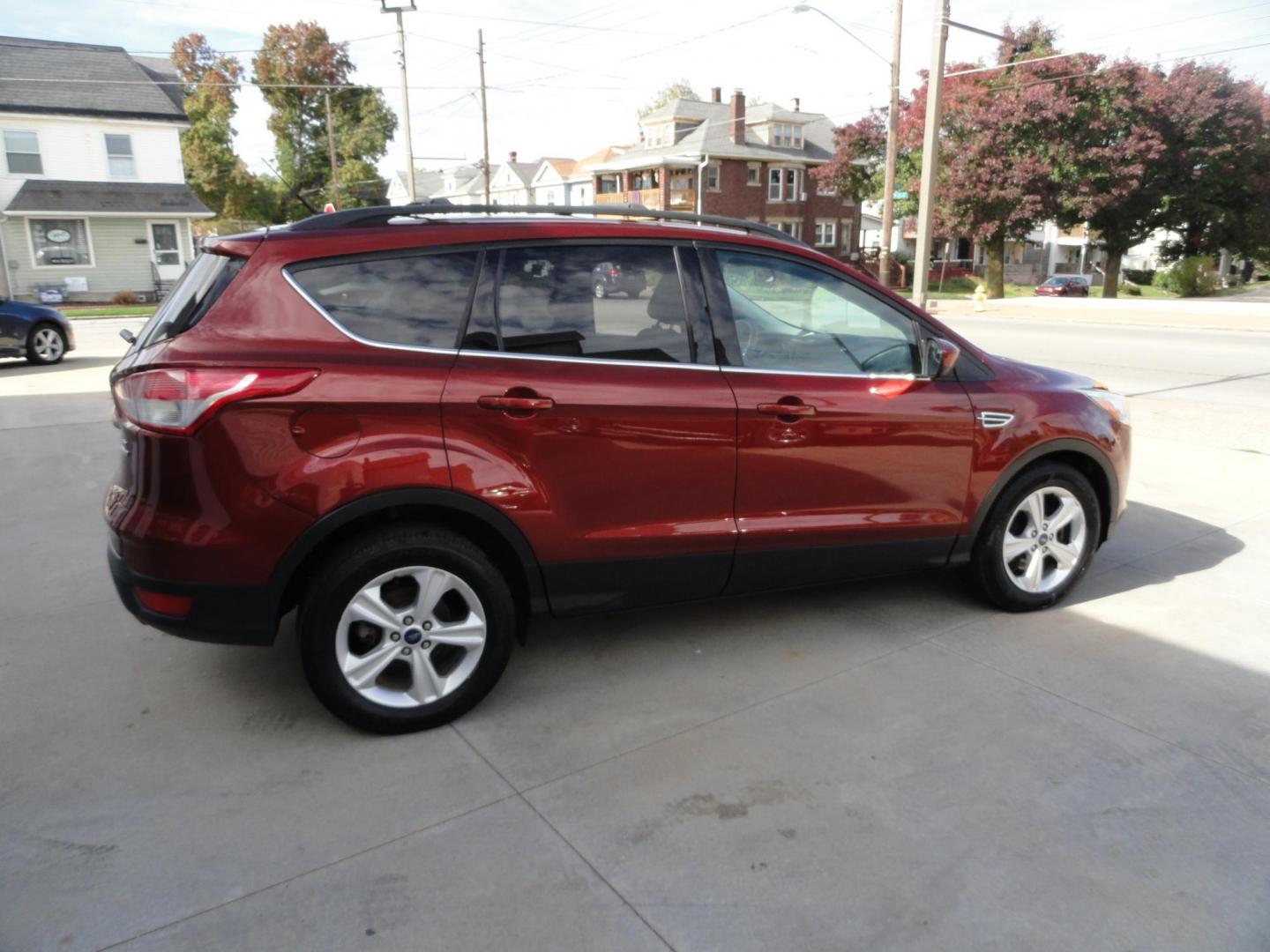 2014 Sunset Metallic /Greystone Ford Escape SE 4WD (1FMCU9GX3EU) with an 1.6L L4 DOHC 16V engine, 6-Speed Automatic transmission, located at 827 W 26th Street, Erie, PA, 16508, (814) 455-3401, 42.105431, -80.090942 - Thanks for looking at out two owner accident and rust-free new arrival. This is the SE model with all wheel drive, power drivers sear, panoramic sunroof, rear parking aids, back up camera, large touch screen and lots more. A full service was just completed in our service department with new Pa state - Photo#3