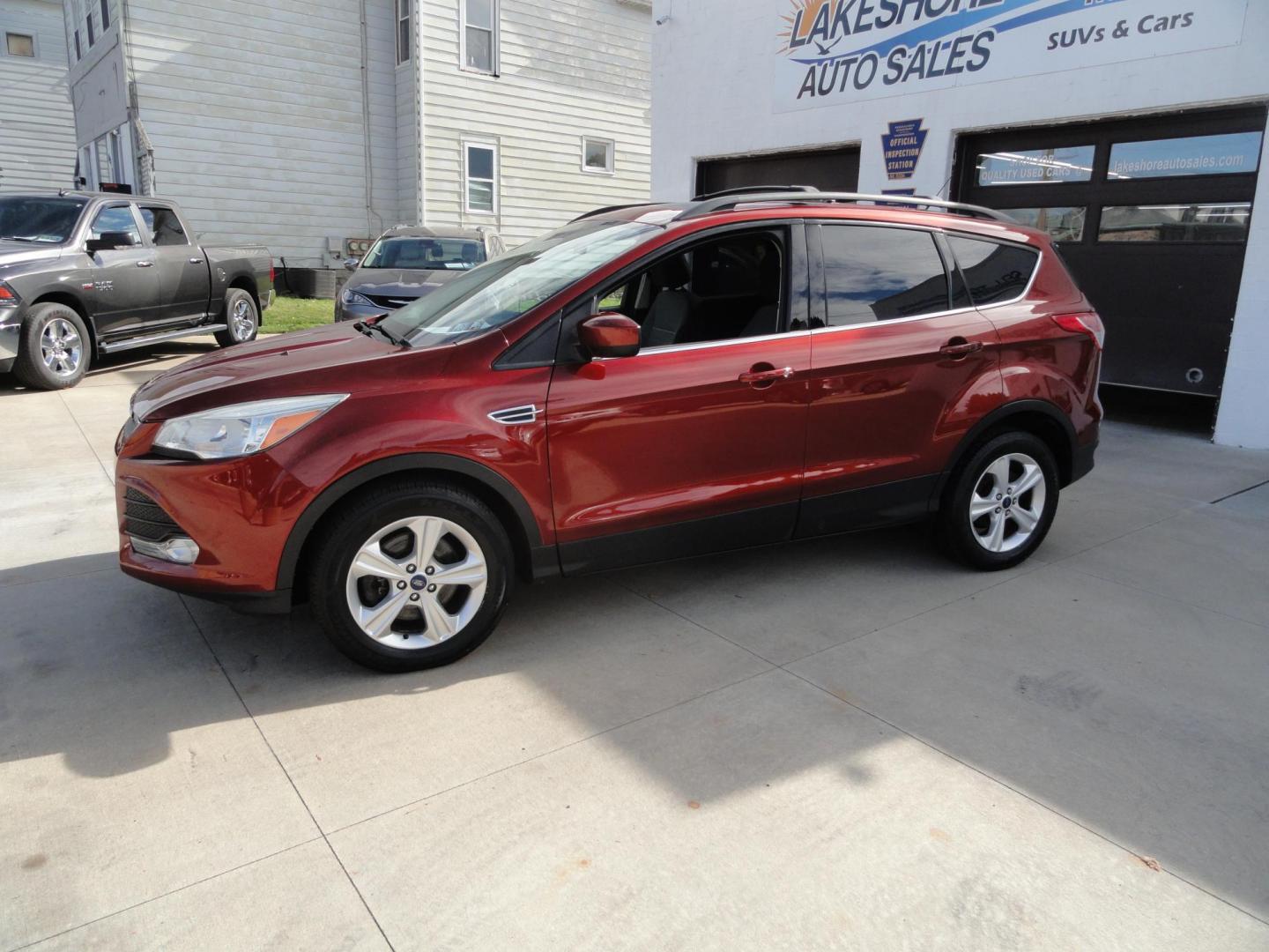 2014 Sunset Metallic /Greystone Ford Escape SE 4WD (1FMCU9GX3EU) with an 1.6L L4 DOHC 16V engine, 6-Speed Automatic transmission, located at 827 W 26th Street, Erie, PA, 16508, (814) 455-3401, 42.105431, -80.090942 - Thanks for looking at out two owner accident and rust-free new arrival. This is the SE model with all wheel drive, power drivers sear, panoramic sunroof, rear parking aids, back up camera, large touch screen and lots more. A full service was just completed in our service department with new Pa state - Photo#6