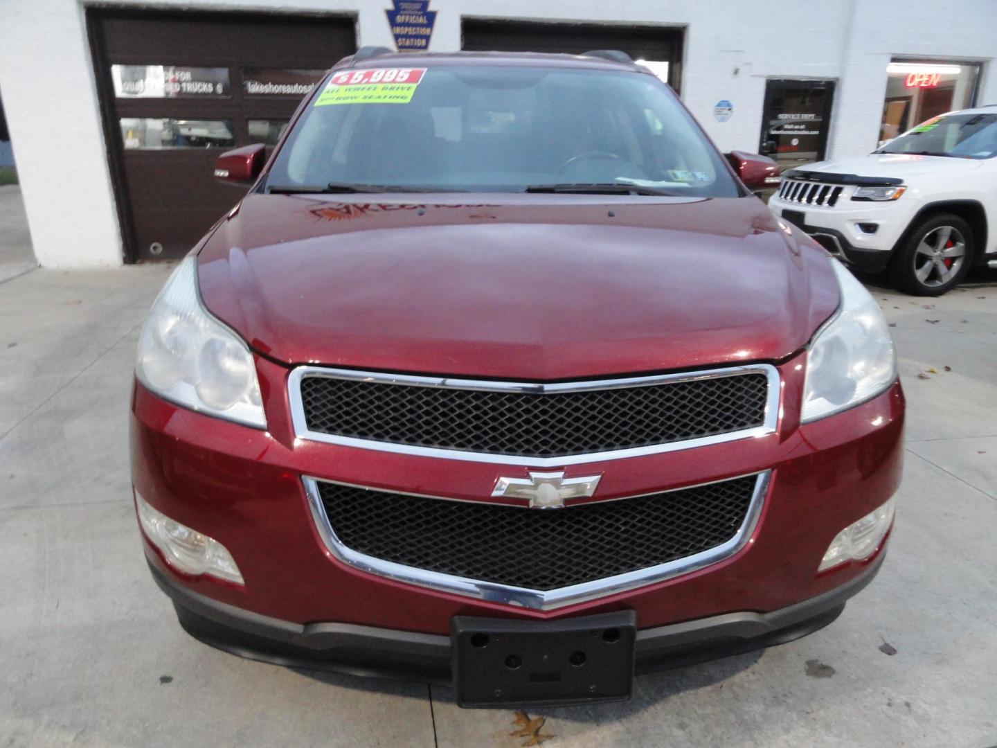 2011 Red Jewel Tintcoat /Graphite Chevrolet Traverse LT AWD (1GNKVGED3BJ) with an 3.6L V6 DOHC 24V engine, 6-Speed Automatic transmission, located at 827 W 26th Street, Erie, PA, 16508, (814) 455-3401, 42.105431, -80.090942 - Photo#1