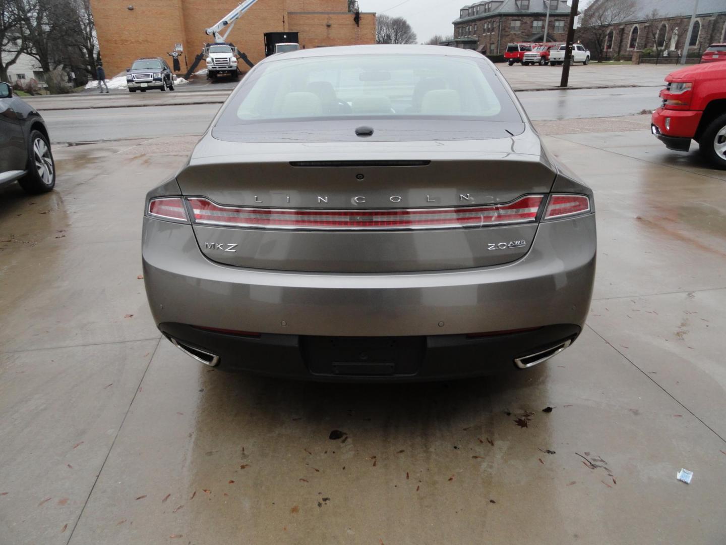 2015 Luxe Metallic /Island Lincoln MKZ AWD (3LN6L2J91FR) with an 2.0L L4 DOHC 16V engine, 6-Speed Automatic transmission, located at 827 W 26th Street, Erie, PA, 16508, (814) 455-3401, 42.105431, -80.090942 - Thanks for looking at our low mileage two owner accident-free new arrival. This is the all-wheel drive model with way too many options to mention. A full service was just completed in our service department and she's ready to go. Hurry in or call today as ones this clean in this price range with low - Photo#5