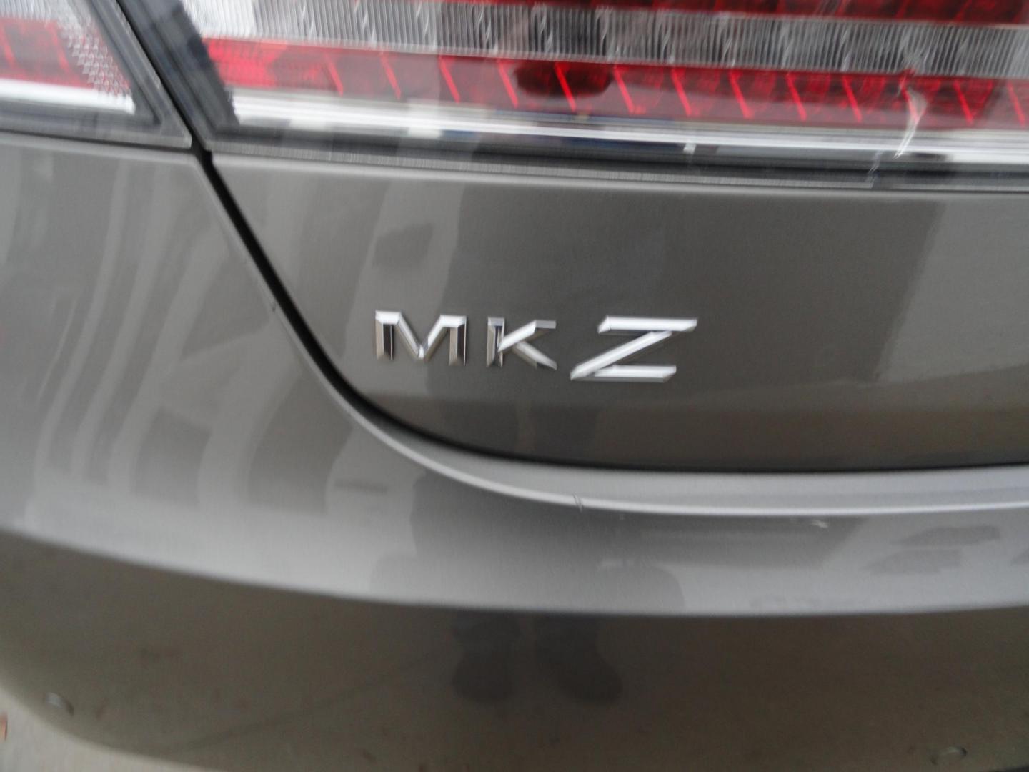 2015 Luxe Metallic /Island Lincoln MKZ AWD (3LN6L2J91FR) with an 2.0L L4 DOHC 16V engine, 6-Speed Automatic transmission, located at 827 W 26th Street, Erie, PA, 16508, (814) 455-3401, 42.105431, -80.090942 - Thanks for looking at our low mileage two owner accident-free new arrival. This is the all-wheel drive model with way too many options to mention. A full service was just completed in our service department and she's ready to go. Hurry in or call today as ones this clean in this price range with low - Photo#8