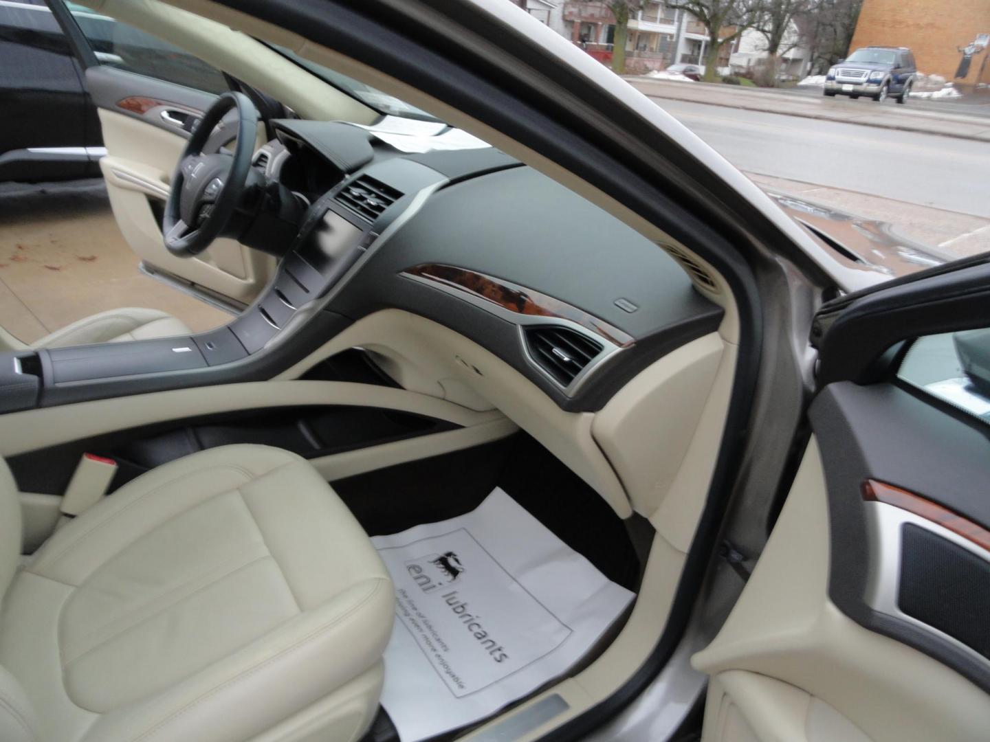 2015 Luxe Metallic /Island Lincoln MKZ AWD (3LN6L2J91FR) with an 2.0L L4 DOHC 16V engine, 6-Speed Automatic transmission, located at 827 W 26th Street, Erie, PA, 16508, (814) 455-3401, 42.105431, -80.090942 - Thanks for looking at our low mileage two owner accident-free new arrival. This is the all-wheel drive model with way too many options to mention. A full service was just completed in our service department and she's ready to go. Hurry in or call today as ones this clean in this price range with low - Photo#32