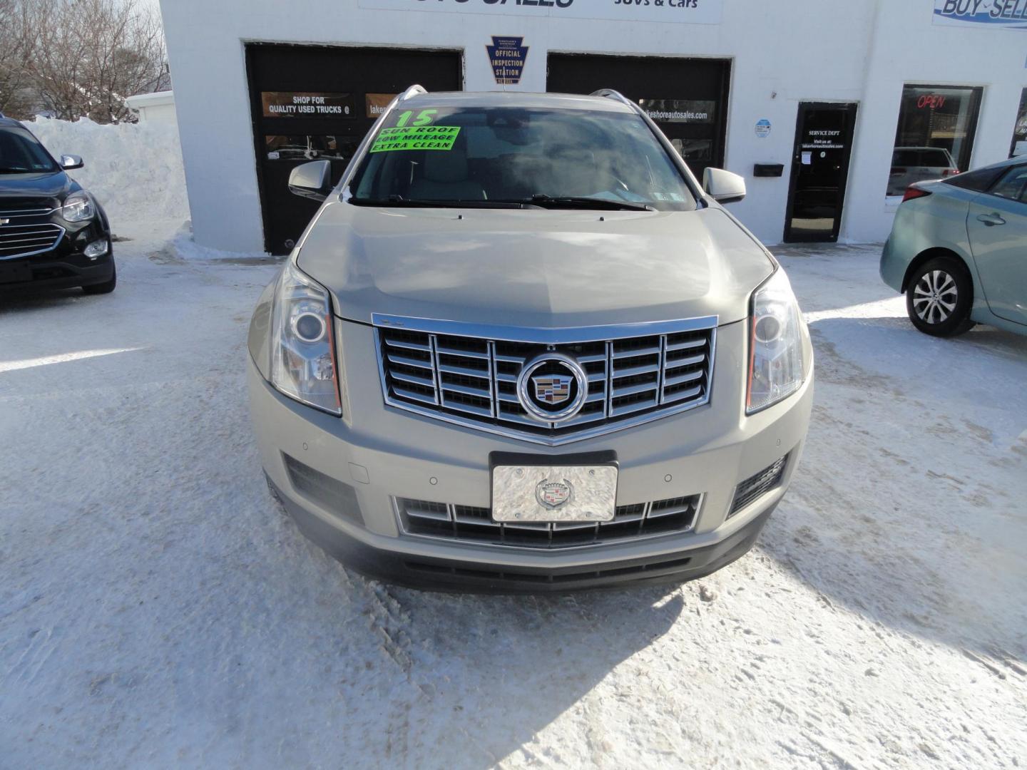 2015 Champagne Silver Metallic /Tan Cadillac SRX Luxury Collection FWD (3GYFNBE31FS) with an 3.6L V6 DOHC 24V FFV engine, 6-Speed Automatic transmission, located at 827 W 26th Street, Erie, PA, 16508, (814) 455-3401, 42.105431, -80.090942 - Thanks for looking at our low mileage accident-free new arrival and a recent trade in at a local Chevrolet dealership. This vehicle was originally sold new In Florida which explains the RUST FREE exterior as well as the like new nonsmoker interior plus it comes with lots of options and it also comes - Photo#1