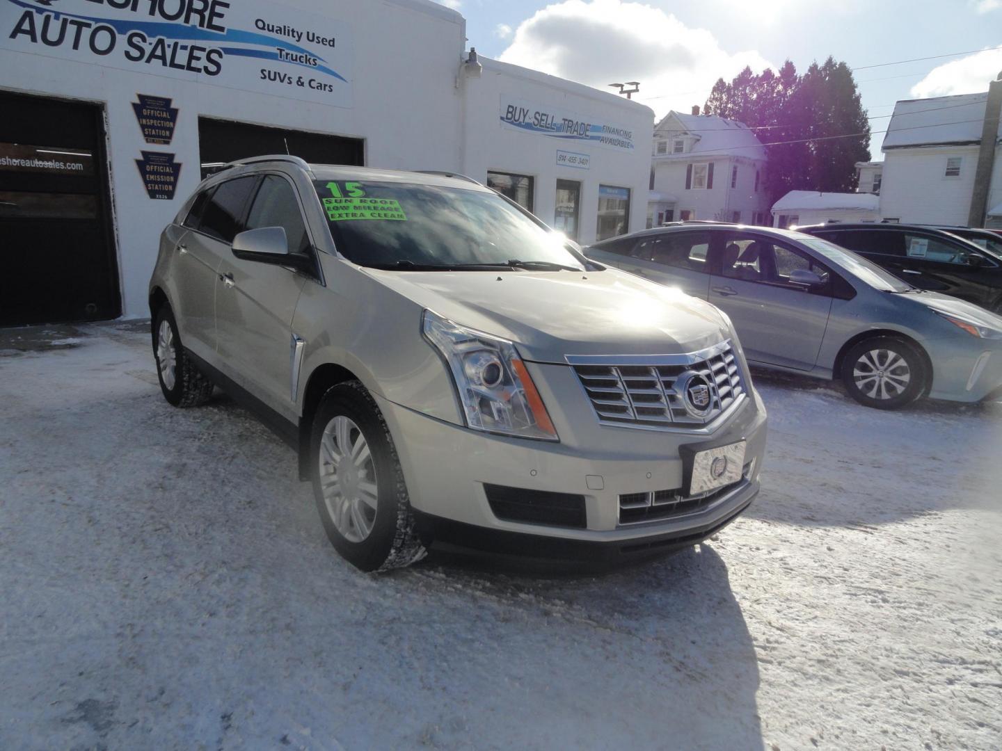 2015 Champagne Silver Metallic /Tan Cadillac SRX Luxury Collection FWD (3GYFNBE31FS) with an 3.6L V6 DOHC 24V FFV engine, 6-Speed Automatic transmission, located at 827 W 26th Street, Erie, PA, 16508, (814) 455-3401, 42.105431, -80.090942 - Thanks for looking at our low mileage accident-free new arrival and a recent trade in at a local Chevrolet dealership. This vehicle was originally sold new In Florida which explains the RUST FREE exterior as well as the like new nonsmoker interior plus it comes with lots of options and it also comes - Photo#0
