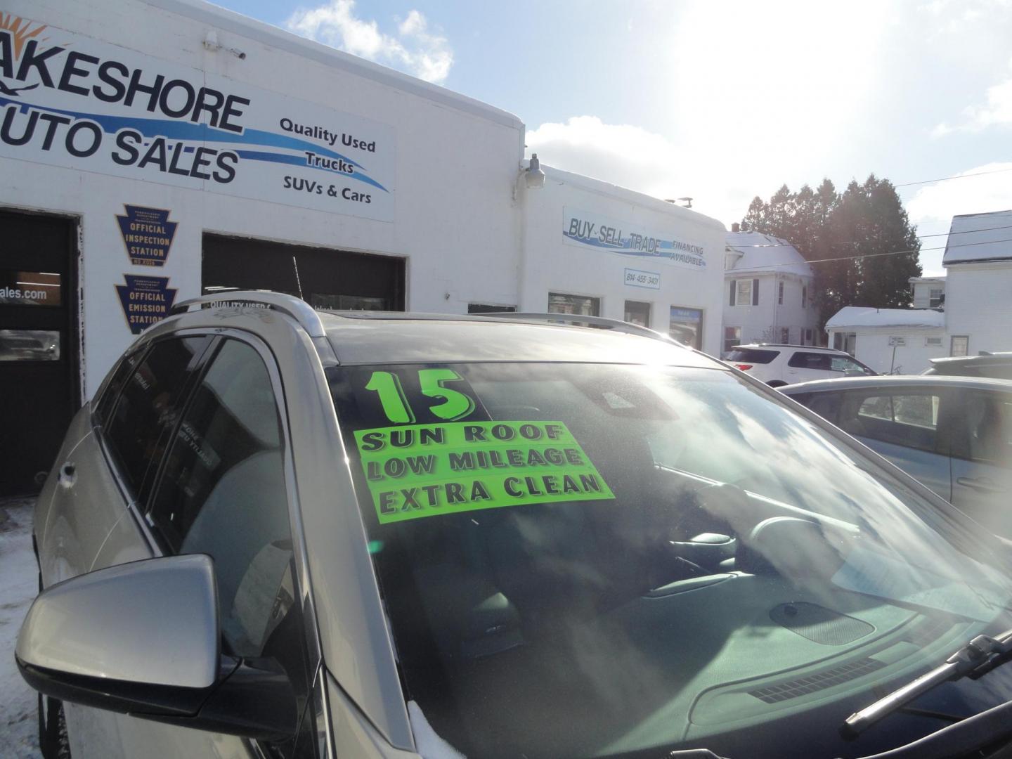 2015 Champagne Silver Metallic /Tan Cadillac SRX Luxury Collection FWD (3GYFNBE31FS) with an 3.6L V6 DOHC 24V FFV engine, 6-Speed Automatic transmission, located at 827 W 26th Street, Erie, PA, 16508, (814) 455-3401, 42.105431, -80.090942 - Thanks for looking at our low mileage accident-free new arrival and a recent trade in at a local Chevrolet dealership. This vehicle was originally sold new In Florida which explains the RUST FREE exterior as well as the like new nonsmoker interior plus it comes with lots of options and it also comes - Photo#2