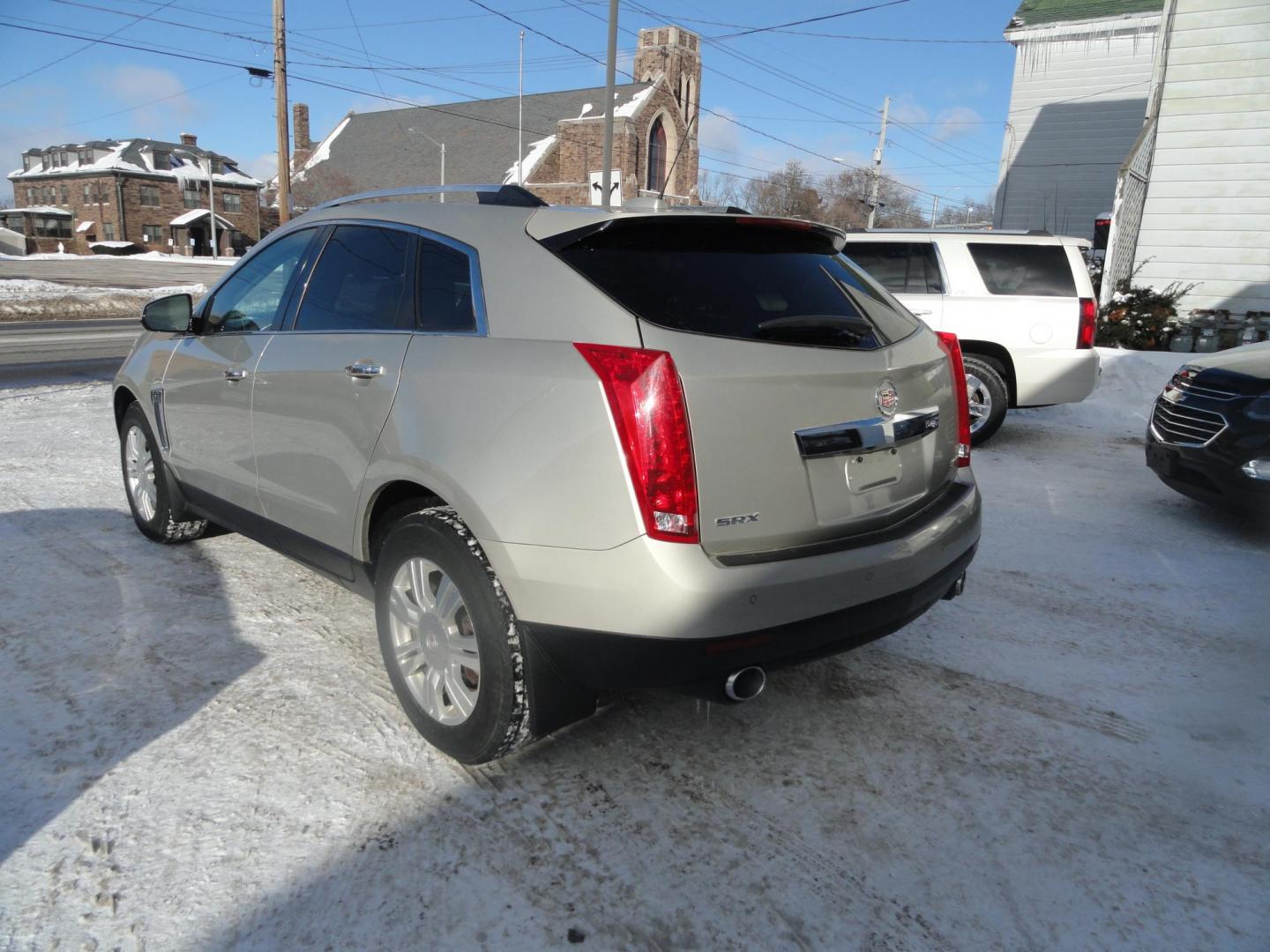 2015 Champagne Silver Metallic /Tan Cadillac SRX Luxury Collection FWD (3GYFNBE31FS) with an 3.6L V6 DOHC 24V FFV engine, 6-Speed Automatic transmission, located at 827 W 26th Street, Erie, PA, 16508, (814) 455-3401, 42.105431, -80.090942 - Thanks for looking at our low mileage accident-free new arrival and a recent trade in at a local Chevrolet dealership. This vehicle was originally sold new In Florida which explains the RUST FREE exterior as well as the like new nonsmoker interior plus it comes with lots of options and it also comes - Photo#5