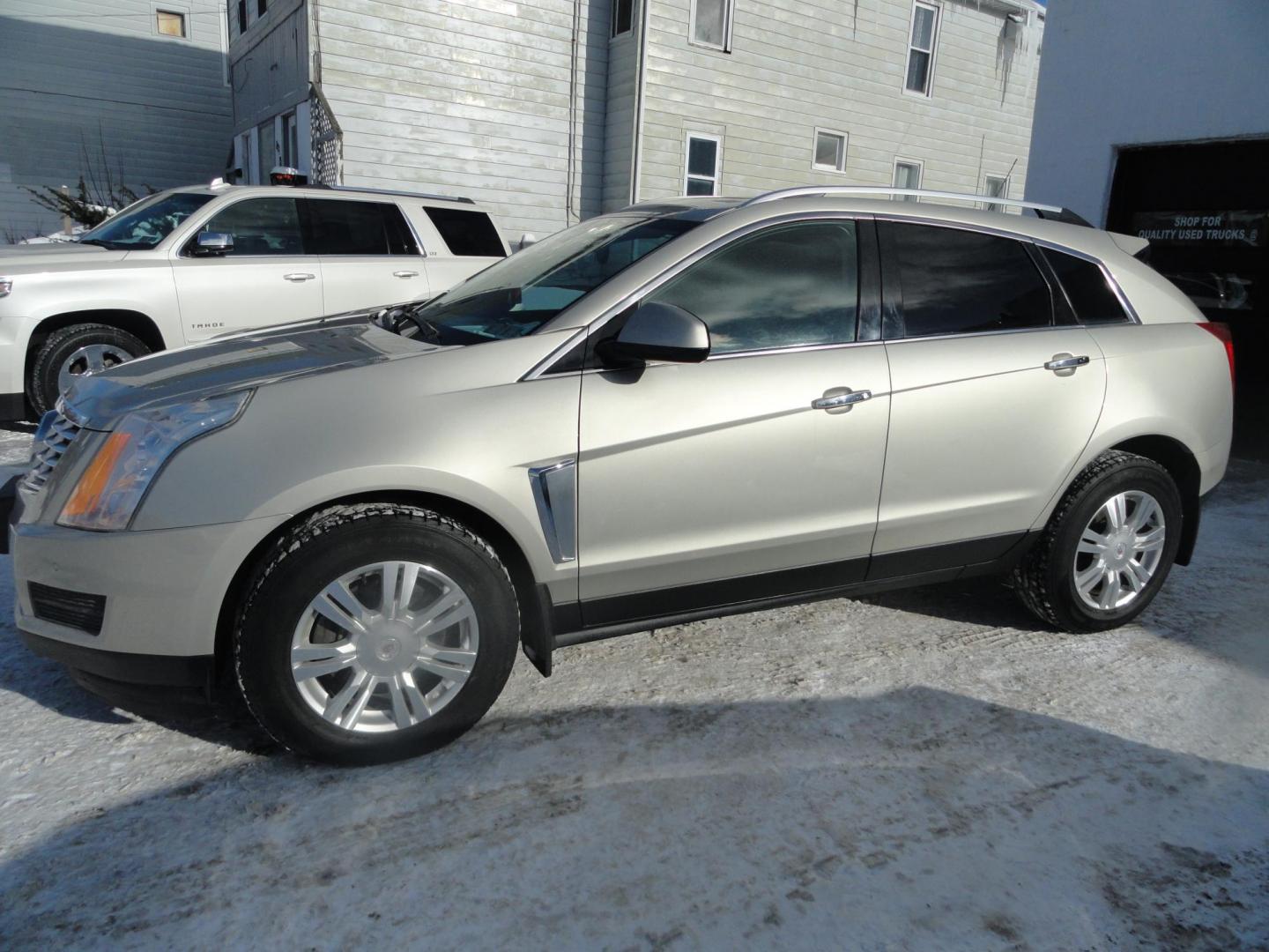 2015 Champagne Silver Metallic /Tan Cadillac SRX Luxury Collection FWD (3GYFNBE31FS) with an 3.6L V6 DOHC 24V FFV engine, 6-Speed Automatic transmission, located at 827 W 26th Street, Erie, PA, 16508, (814) 455-3401, 42.105431, -80.090942 - Thanks for looking at our low mileage accident-free new arrival and a recent trade in at a local Chevrolet dealership. This vehicle was originally sold new In Florida which explains the RUST FREE exterior as well as the like new nonsmoker interior plus it comes with lots of options and it also comes - Photo#6