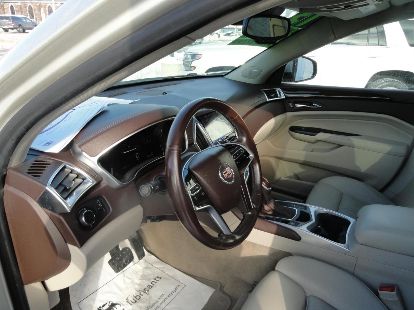 2015 Champagne Silver Metallic /Tan Cadillac SRX Luxury Collection FWD (3GYFNBE31FS) with an 3.6L V6 DOHC 24V FFV engine, 6-Speed Automatic transmission, located at 827 W 26th Street, Erie, PA, 16508, (814) 455-3401, 42.105431, -80.090942 - Thanks for looking at our low mileage accident-free new arrival and a recent trade in at a local Chevrolet dealership. This vehicle was originally sold new In Florida which explains the RUST FREE exterior as well as the like new nonsmoker interior plus it comes with lots of options and it also comes - Photo#16