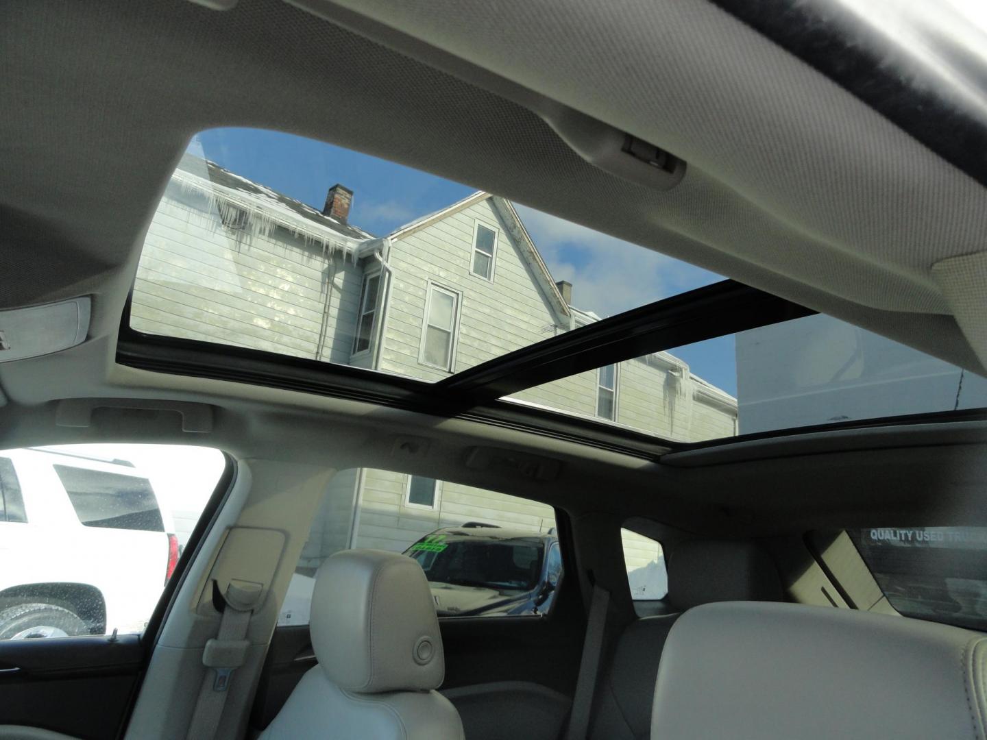 2015 Champagne Silver Metallic /Tan Cadillac SRX Luxury Collection FWD (3GYFNBE31FS) with an 3.6L V6 DOHC 24V FFV engine, 6-Speed Automatic transmission, located at 827 W 26th Street, Erie, PA, 16508, (814) 455-3401, 42.105431, -80.090942 - Thanks for looking at our low mileage accident-free new arrival and a recent trade in at a local Chevrolet dealership. This vehicle was originally sold new In Florida which explains the RUST FREE exterior as well as the like new nonsmoker interior plus it comes with lots of options and it also comes - Photo#18