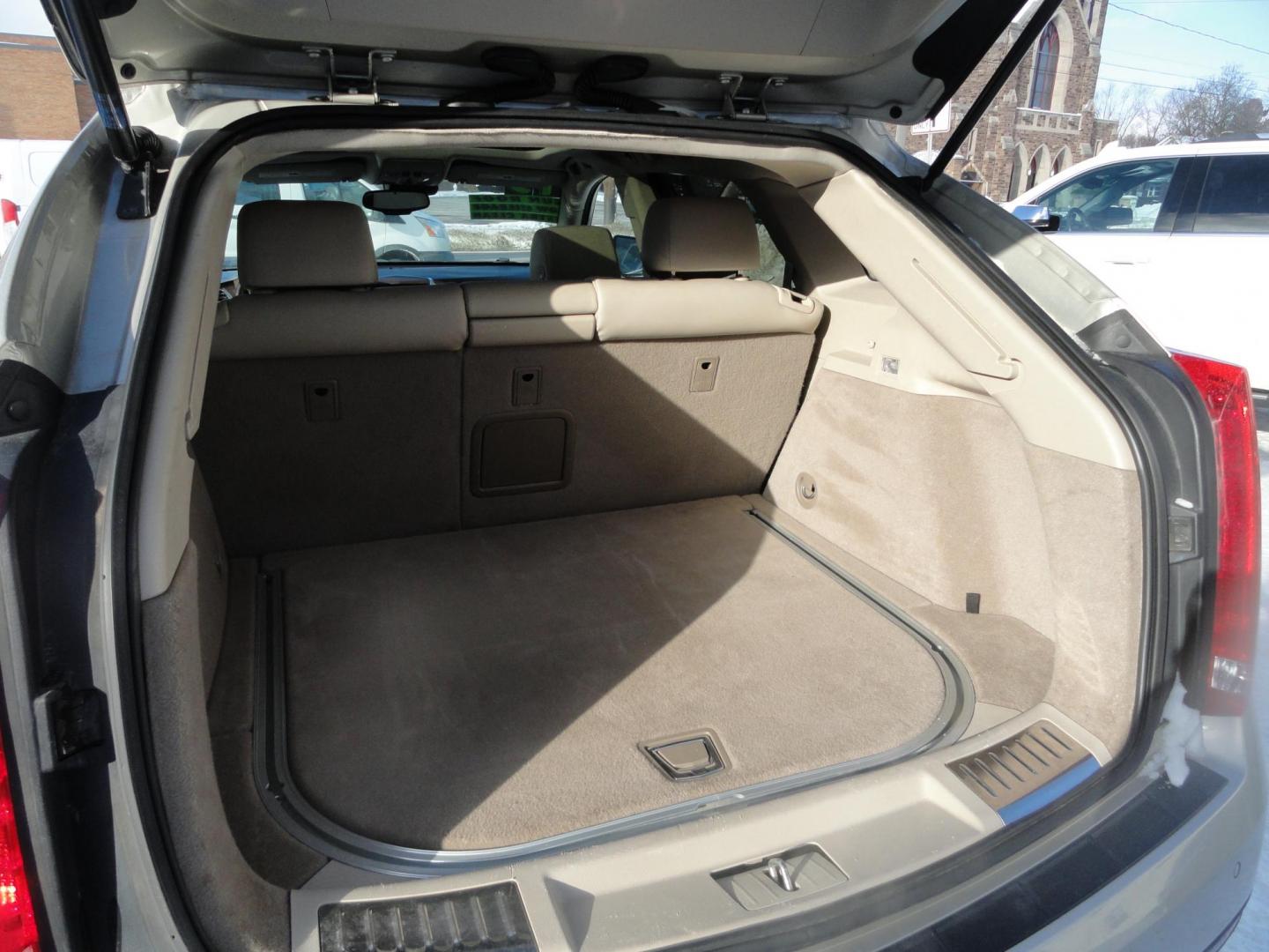 2015 Champagne Silver Metallic /Tan Cadillac SRX Luxury Collection FWD (3GYFNBE31FS) with an 3.6L V6 DOHC 24V FFV engine, 6-Speed Automatic transmission, located at 827 W 26th Street, Erie, PA, 16508, (814) 455-3401, 42.105431, -80.090942 - Thanks for looking at our low mileage accident-free new arrival and a recent trade in at a local Chevrolet dealership. This vehicle was originally sold new In Florida which explains the RUST FREE exterior as well as the like new nonsmoker interior plus it comes with lots of options and it also comes - Photo#25