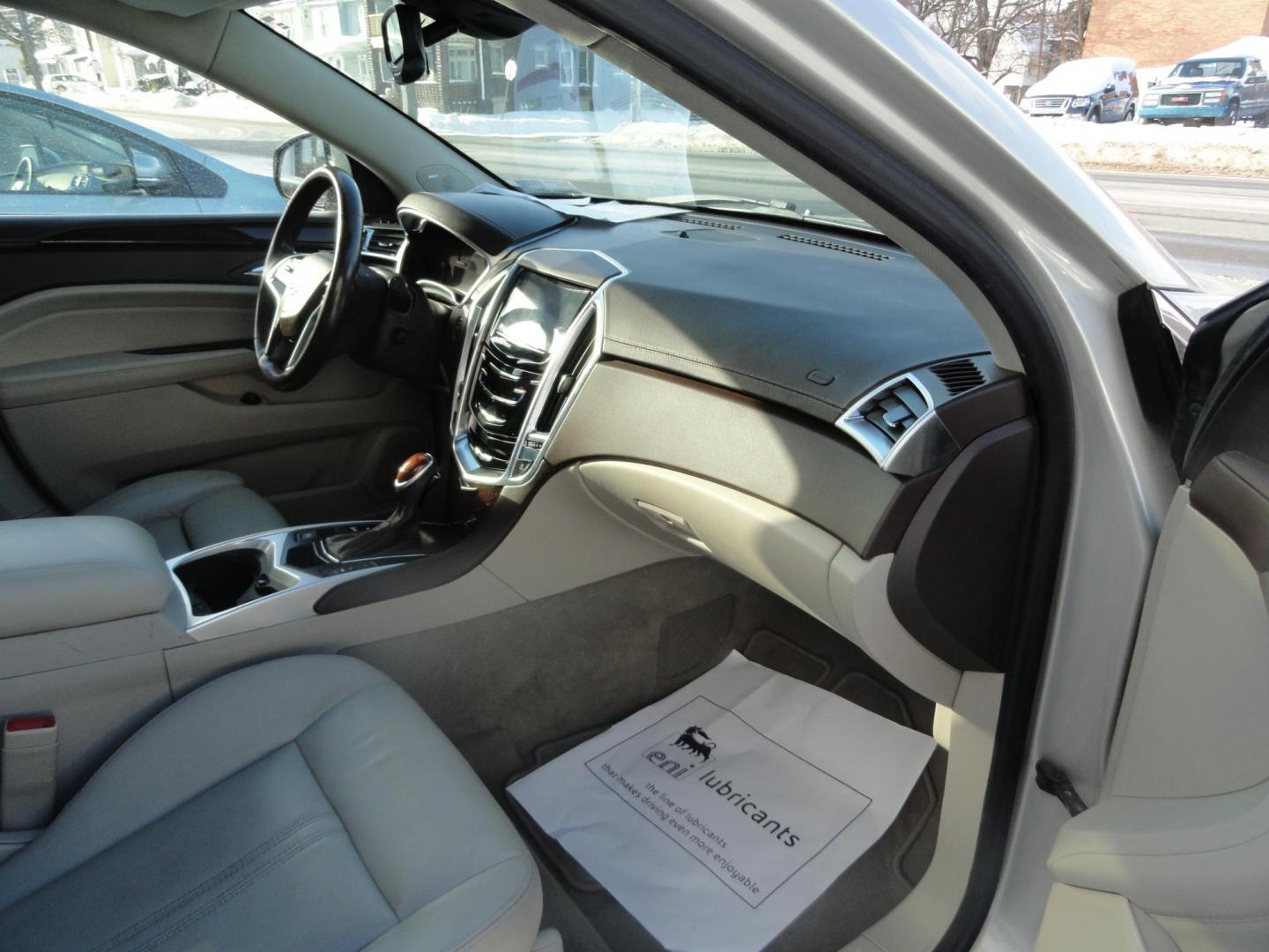 2015 Champagne Silver Metallic /Tan Cadillac SRX Luxury Collection FWD (3GYFNBE31FS) with an 3.6L V6 DOHC 24V FFV engine, 6-Speed Automatic transmission, located at 827 W 26th Street, Erie, PA, 16508, (814) 455-3401, 42.105431, -80.090942 - Thanks for looking at our low mileage accident-free new arrival and a recent trade in at a local Chevrolet dealership. This vehicle was originally sold new In Florida which explains the RUST FREE exterior as well as the like new nonsmoker interior plus it comes with lots of options and it also comes - Photo#29