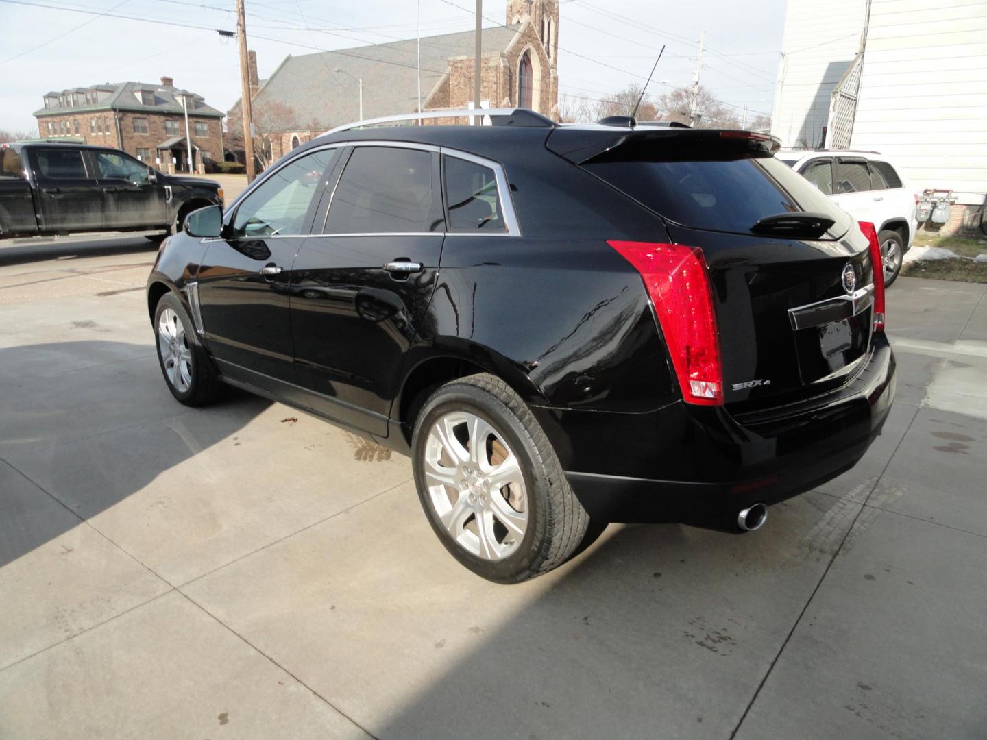 2015 Black Raven /Jet Black Cadillac SRX Performance Collection AWD (3GYFNFE32FS) with an 3.6L V6 DOHC 24V FFV engine, 6-Speed Automatic transmission, located at 827 W 26th Street, Erie, PA, 16508, (814) 455-3401, 42.105431, -80.090942 - Thanks for looking at our low mileage rust and accident-free new Toyota trade. This is the Performance model that started its journey in Florida, then it came up here in the spring of 2021 which explains the excellent condition of this vehicle along with the like new nonsmoker interior and yes, it's - Photo#5
