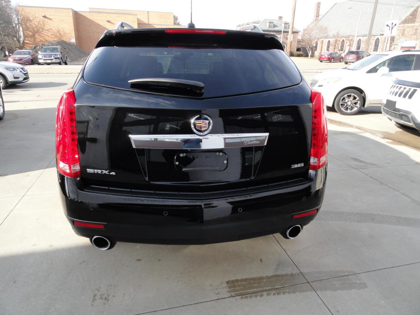 2015 Black Raven /Jet Black Cadillac SRX Performance Collection AWD (3GYFNFE32FS) with an 3.6L V6 DOHC 24V FFV engine, 6-Speed Automatic transmission, located at 827 W 26th Street, Erie, PA, 16508, (814) 455-3401, 42.105431, -80.090942 - Thanks for looking at our low mileage rust and accident-free new Toyota trade. This is the Performance model that started its journey in Florida, then it came up here in the spring of 2021 which explains the excellent condition of this vehicle along with the like new nonsmoker interior and yes, it's - Photo#4