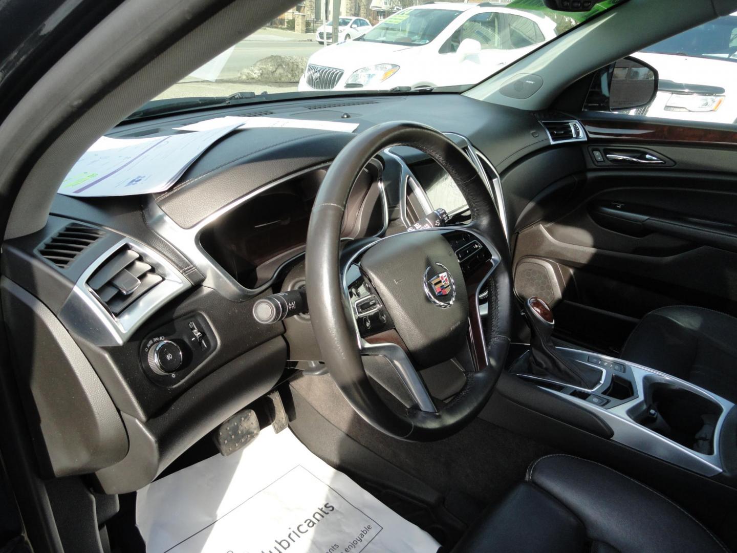 2015 Black Raven /Jet Black Cadillac SRX Performance Collection AWD (3GYFNFE32FS) with an 3.6L V6 DOHC 24V FFV engine, 6-Speed Automatic transmission, located at 827 W 26th Street, Erie, PA, 16508, (814) 455-3401, 42.105431, -80.090942 - Thanks for looking at our low mileage rust and accident-free new Toyota trade. This is the Performance model that started its journey in Florida, then it came up here in the spring of 2021 which explains the excellent condition of this vehicle along with the like new nonsmoker interior and yes, it's - Photo#22