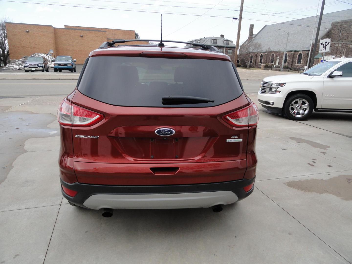 2015 Sunset Matallic /Tan Ford Escape SE FWD (1FMCU0GX6FU) with an 1.6L L4 DOHC 16V engine, 6-Speed Automatic transmission, located at 827 W 26th Street, Erie, PA, 16508, (814) 455-3401, 42.105431, -80.090942 - Photo#4