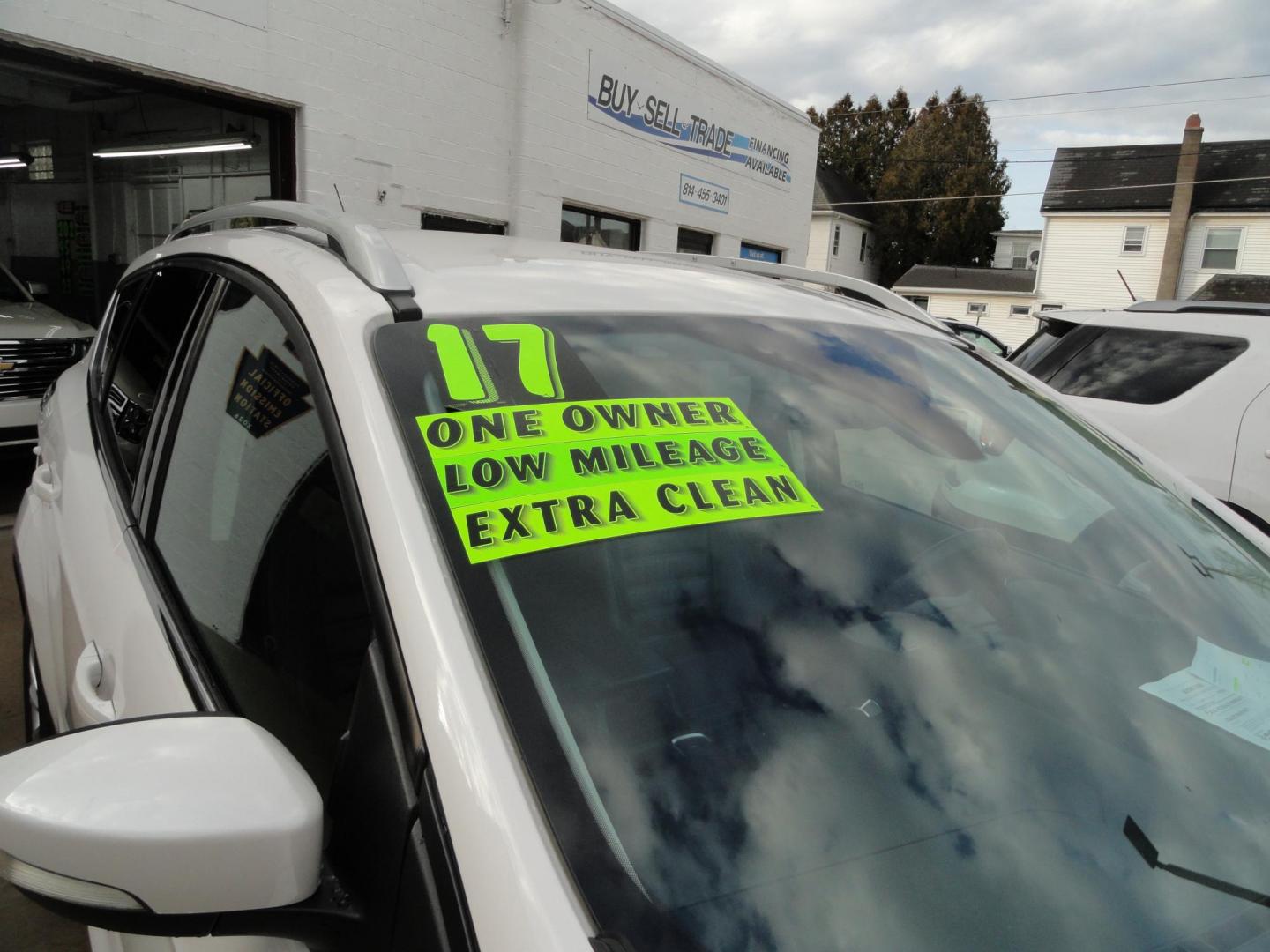2017 White Titanium /Jet Black Ford Escape Titanium 4WD (1FMCU9JD7HU) with an 1.5L L4 DOHC 16V engine, 6-Speed Automatic transmission, located at 827 W 26th Street, Erie, PA, 16508, (814) 455-3401, 42.105431, -80.090942 - Thanks for looking at our one owner accident and rust-free new arrival. This is the top-of-the-line Titanium model with four-wheel drive, dual power heated leather front seats, remote start, back up camera, push button start, lane departure. blind spot monitor and lots more including two sets of fac - Photo#2