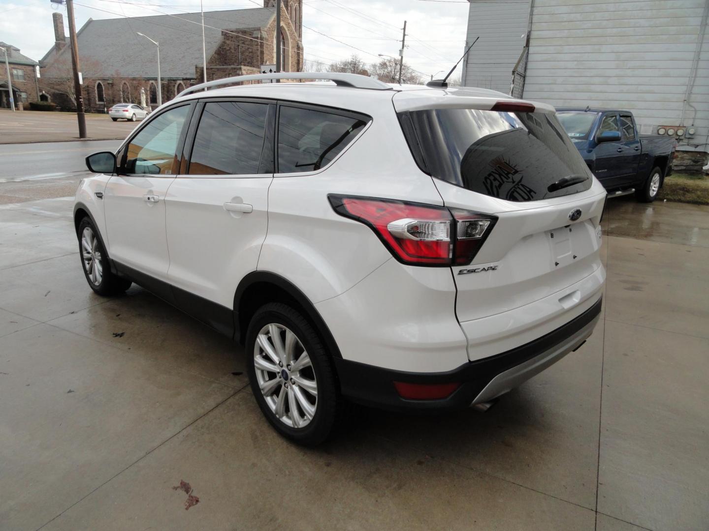 2017 White Titanium /Jet Black Ford Escape Titanium 4WD (1FMCU9JD7HU) with an 1.5L L4 DOHC 16V engine, 6-Speed Automatic transmission, located at 827 W 26th Street, Erie, PA, 16508, (814) 455-3401, 42.105431, -80.090942 - Thanks for looking at our one owner accident and rust-free new arrival. This is the top-of-the-line Titanium model with four-wheel drive, dual power heated leather front seats, remote start, back up camera, push button start, lane departure. blind spot monitor and lots more including two sets of fac - Photo#5