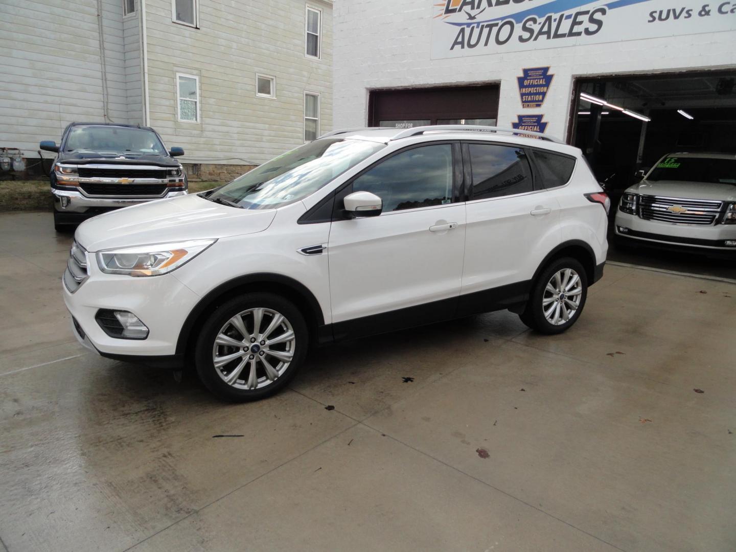 2017 White Titanium /Jet Black Ford Escape Titanium 4WD (1FMCU9JD7HU) with an 1.5L L4 DOHC 16V engine, 6-Speed Automatic transmission, located at 827 W 26th Street, Erie, PA, 16508, (814) 455-3401, 42.105431, -80.090942 - Thanks for looking at our one owner accident and rust-free new arrival. This is the top-of-the-line Titanium model with four-wheel drive, dual power heated leather front seats, remote start, back up camera, push button start, lane departure. blind spot monitor and lots more including two sets of fac - Photo#6