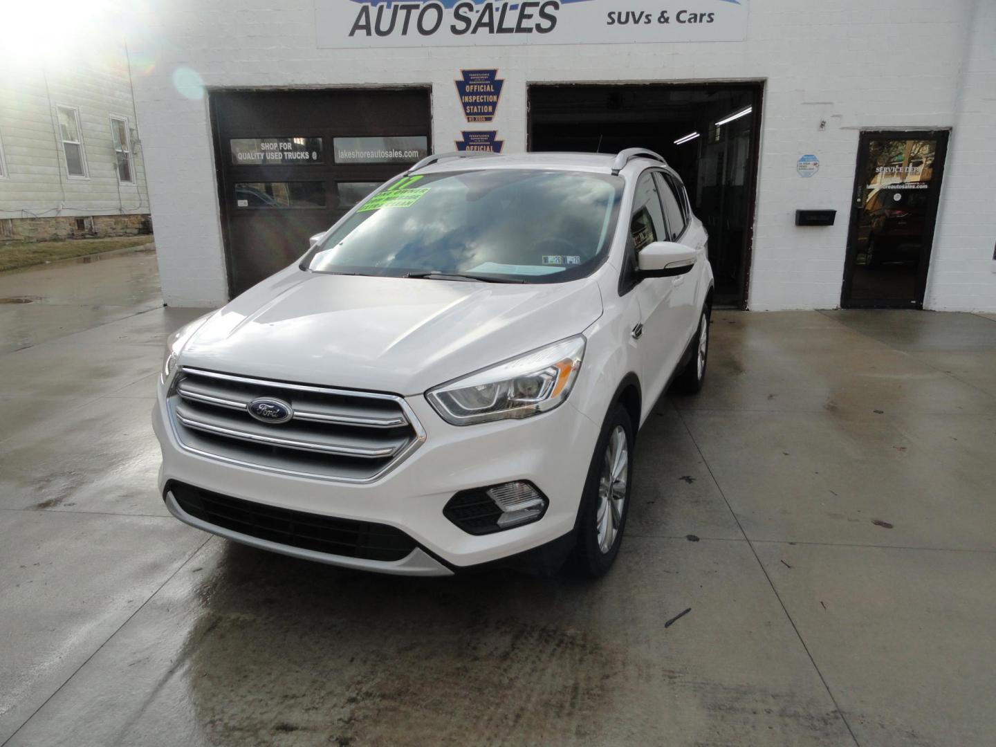 2017 White Titanium /Jet Black Ford Escape Titanium 4WD (1FMCU9JD7HU) with an 1.5L L4 DOHC 16V engine, 6-Speed Automatic transmission, located at 827 W 26th Street, Erie, PA, 16508, (814) 455-3401, 42.105431, -80.090942 - Thanks for looking at our one owner accident and rust-free new arrival. This is the top-of-the-line Titanium model with four-wheel drive, dual power heated leather front seats, remote start, back up camera, push button start, lane departure. blind spot monitor and lots more including two sets of fac - Photo#7