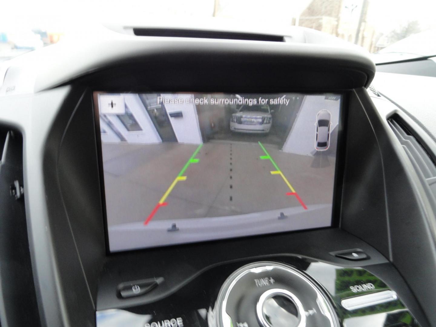 2017 White Titanium /Jet Black Ford Escape Titanium 4WD (1FMCU9JD7HU) with an 1.5L L4 DOHC 16V engine, 6-Speed Automatic transmission, located at 827 W 26th Street, Erie, PA, 16508, (814) 455-3401, 42.105431, -80.090942 - Thanks for looking at our one owner accident and rust-free new arrival. This is the top-of-the-line Titanium model with four-wheel drive, dual power heated leather front seats, remote start, back up camera, push button start, lane departure. blind spot monitor and lots more including two sets of fac - Photo#11