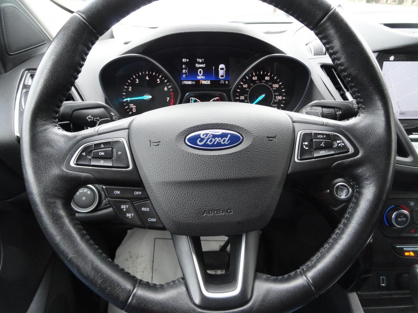 2017 White Titanium /Jet Black Ford Escape Titanium 4WD (1FMCU9JD7HU) with an 1.5L L4 DOHC 16V engine, 6-Speed Automatic transmission, located at 827 W 26th Street, Erie, PA, 16508, (814) 455-3401, 42.105431, -80.090942 - Thanks for looking at our one owner accident and rust-free new arrival. This is the top-of-the-line Titanium model with four-wheel drive, dual power heated leather front seats, remote start, back up camera, push button start, lane departure. blind spot monitor and lots more including two sets of fac - Photo#17