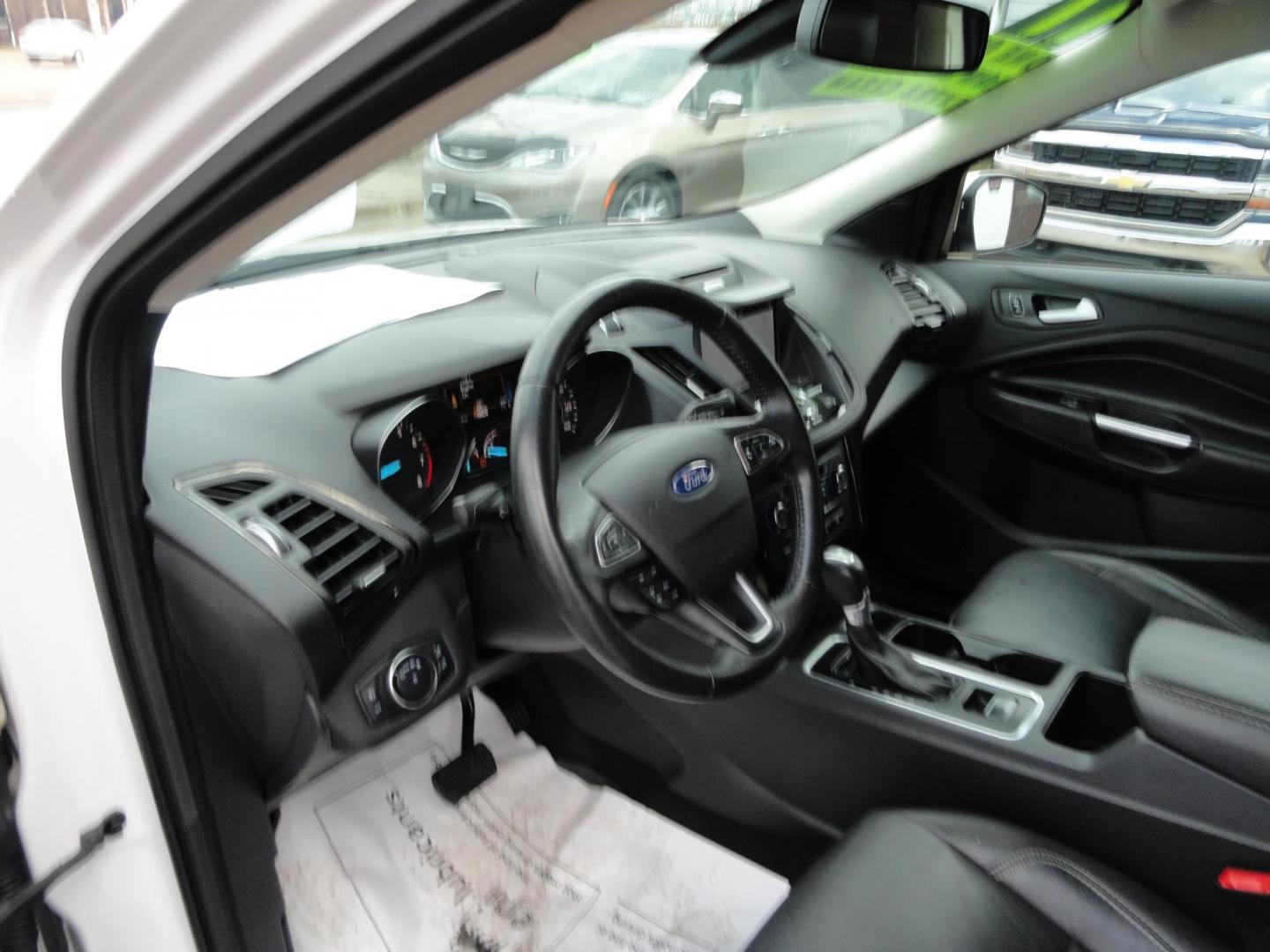 2017 White Titanium /Jet Black Ford Escape Titanium 4WD (1FMCU9JD7HU) with an 1.5L L4 DOHC 16V engine, 6-Speed Automatic transmission, located at 827 W 26th Street, Erie, PA, 16508, (814) 455-3401, 42.105431, -80.090942 - Thanks for looking at our one owner accident and rust-free new arrival. This is the top-of-the-line Titanium model with four-wheel drive, dual power heated leather front seats, remote start, back up camera, push button start, lane departure. blind spot monitor and lots more including two sets of fac - Photo#23